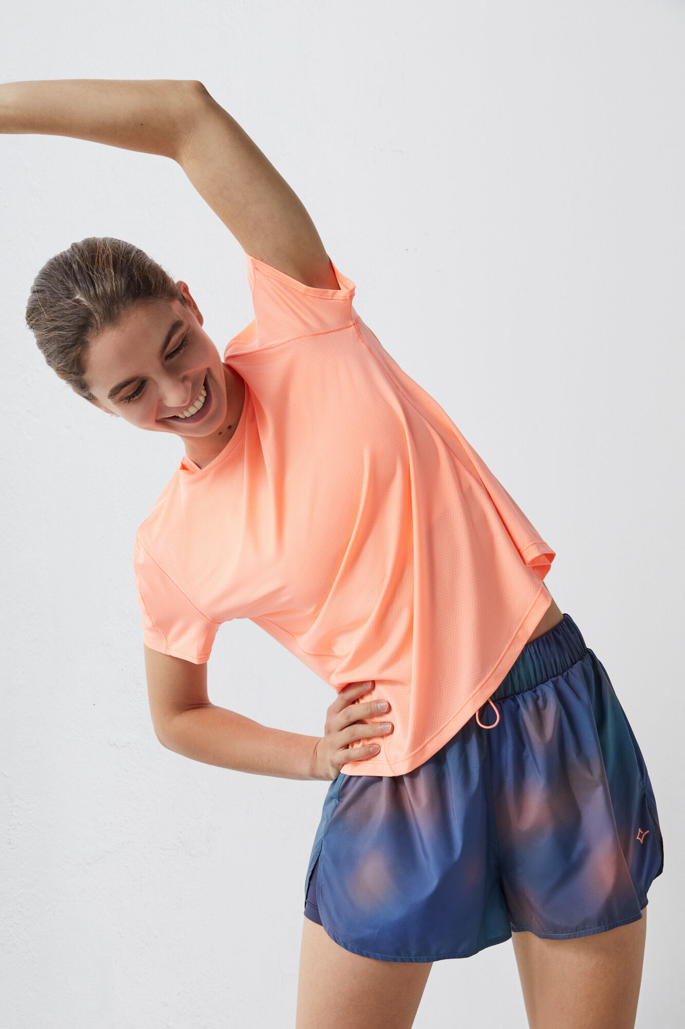 Camiseta técnica respirável laranja-avermelhada