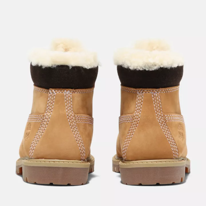 Bota de inverno Timberland Premium de 6 polegadas para crianças pequenas, na cor amarela.