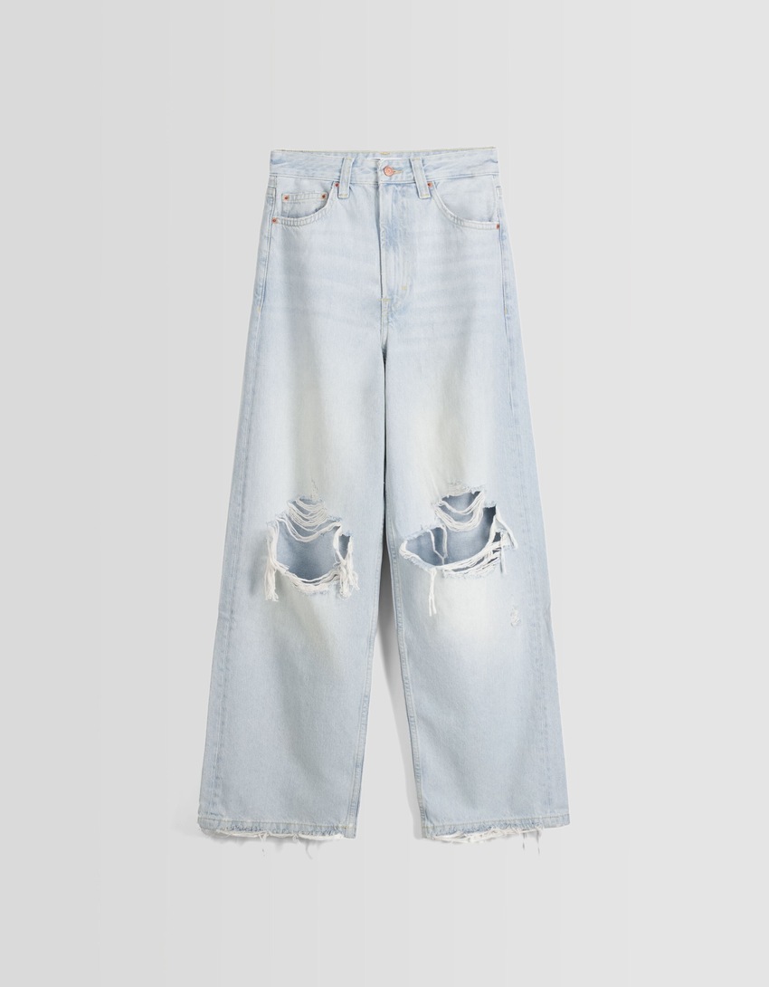 Jeans desbotados, rasgados e super folgados