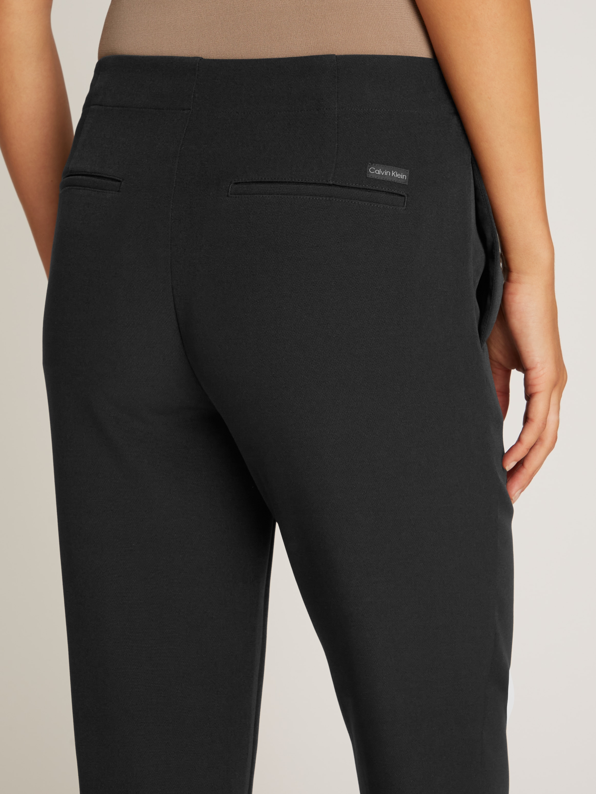 Calvin Klein Jeans Bootcuthose »SPLIT HEM SLIM LEG PANT«  Gesässtaschen, Logodruck