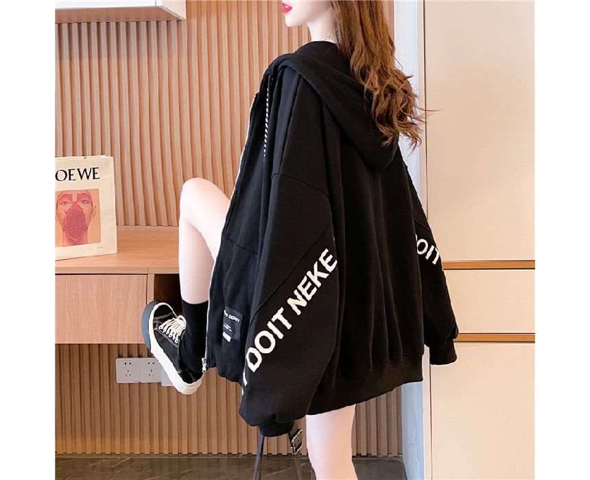 Carotaine - Oversized hoodie met rits en letters