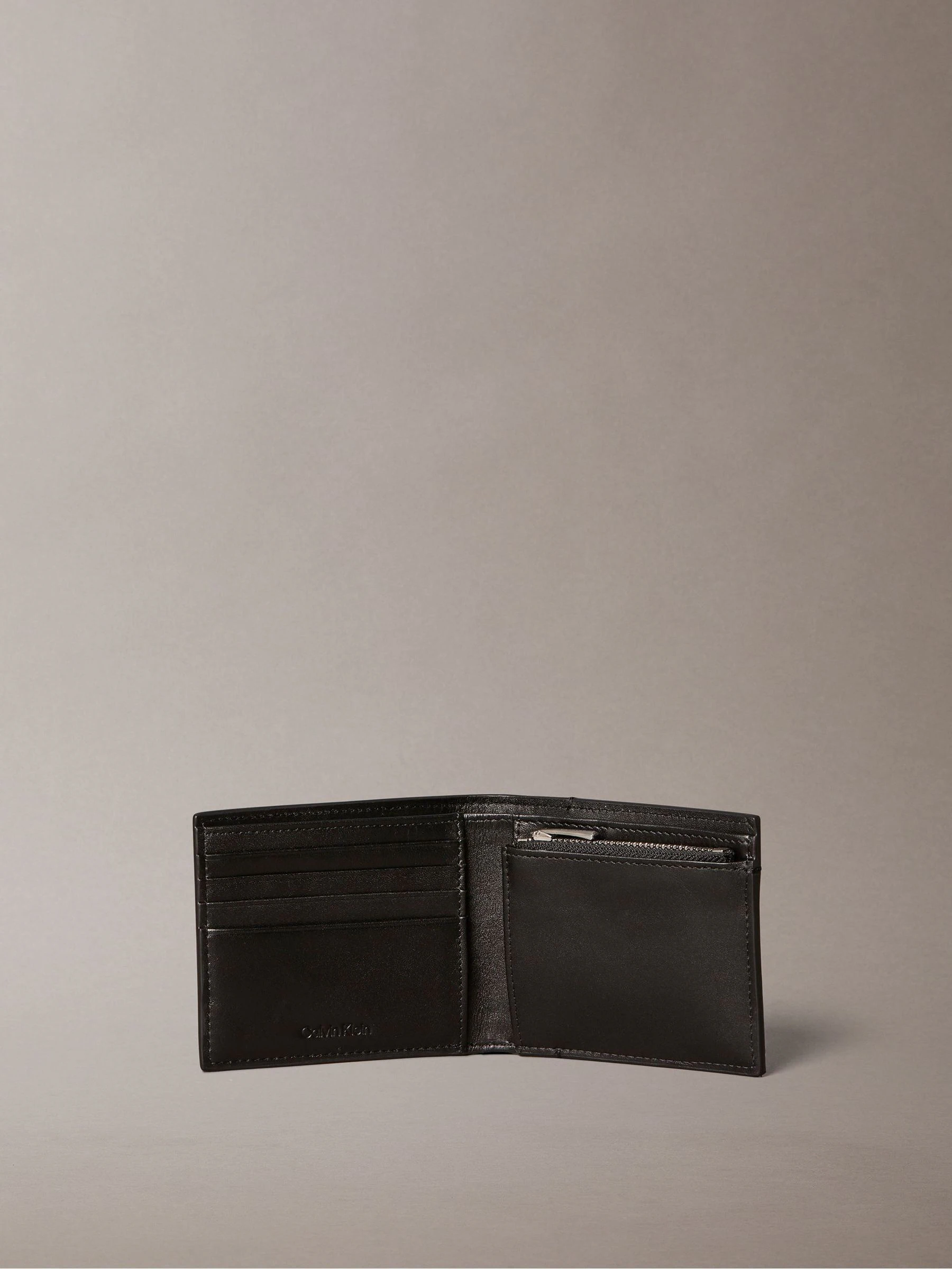 Calvin Klein Embossed Allover Monogram Bifold Wallet with Coin Pouch