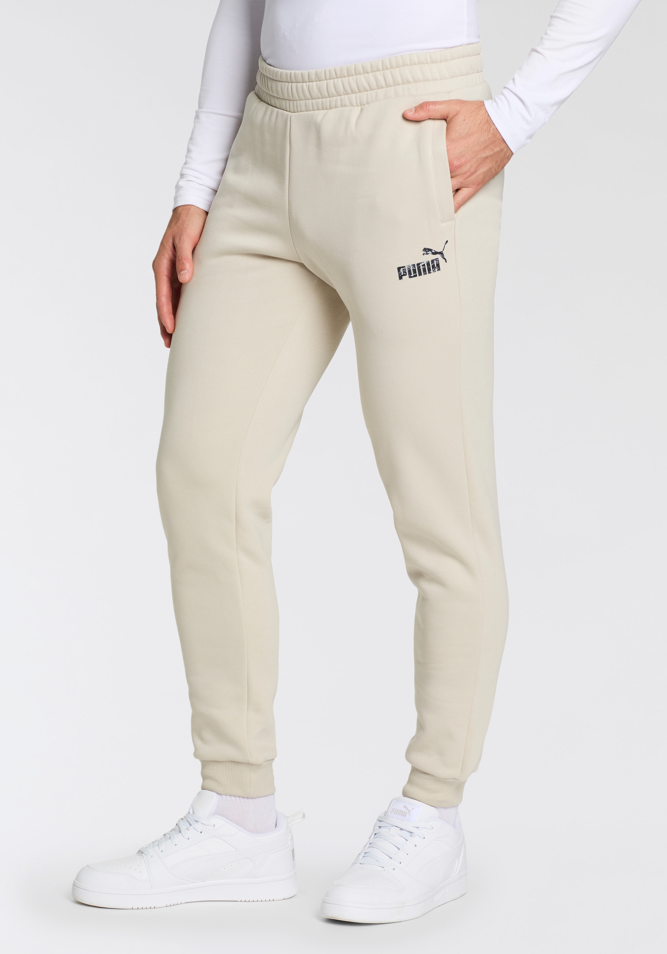 PUMA Trainingshose »ESS+ CAMO SWEATPANTS FL CL«