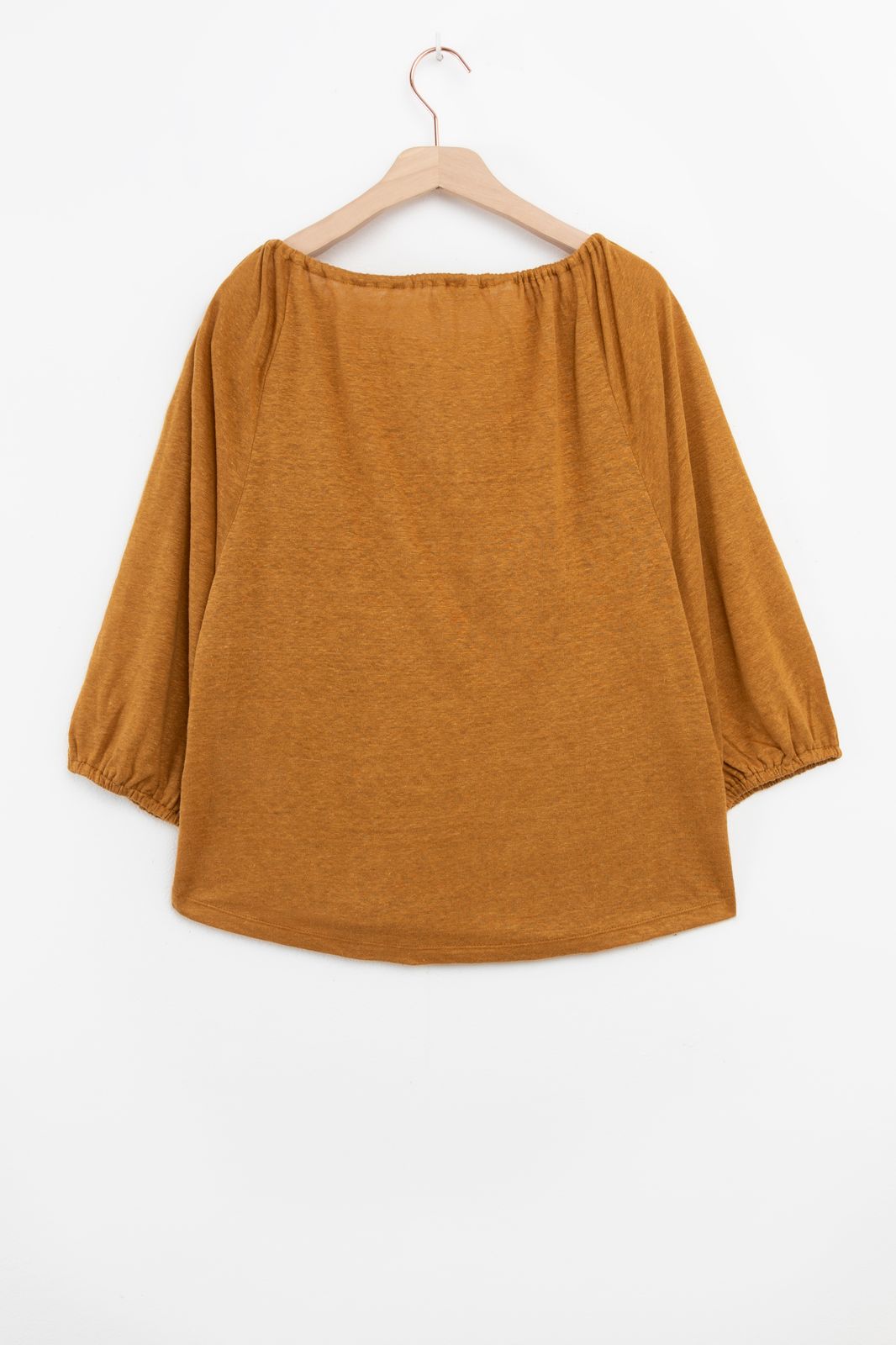 Goudbruine top met kwastjes