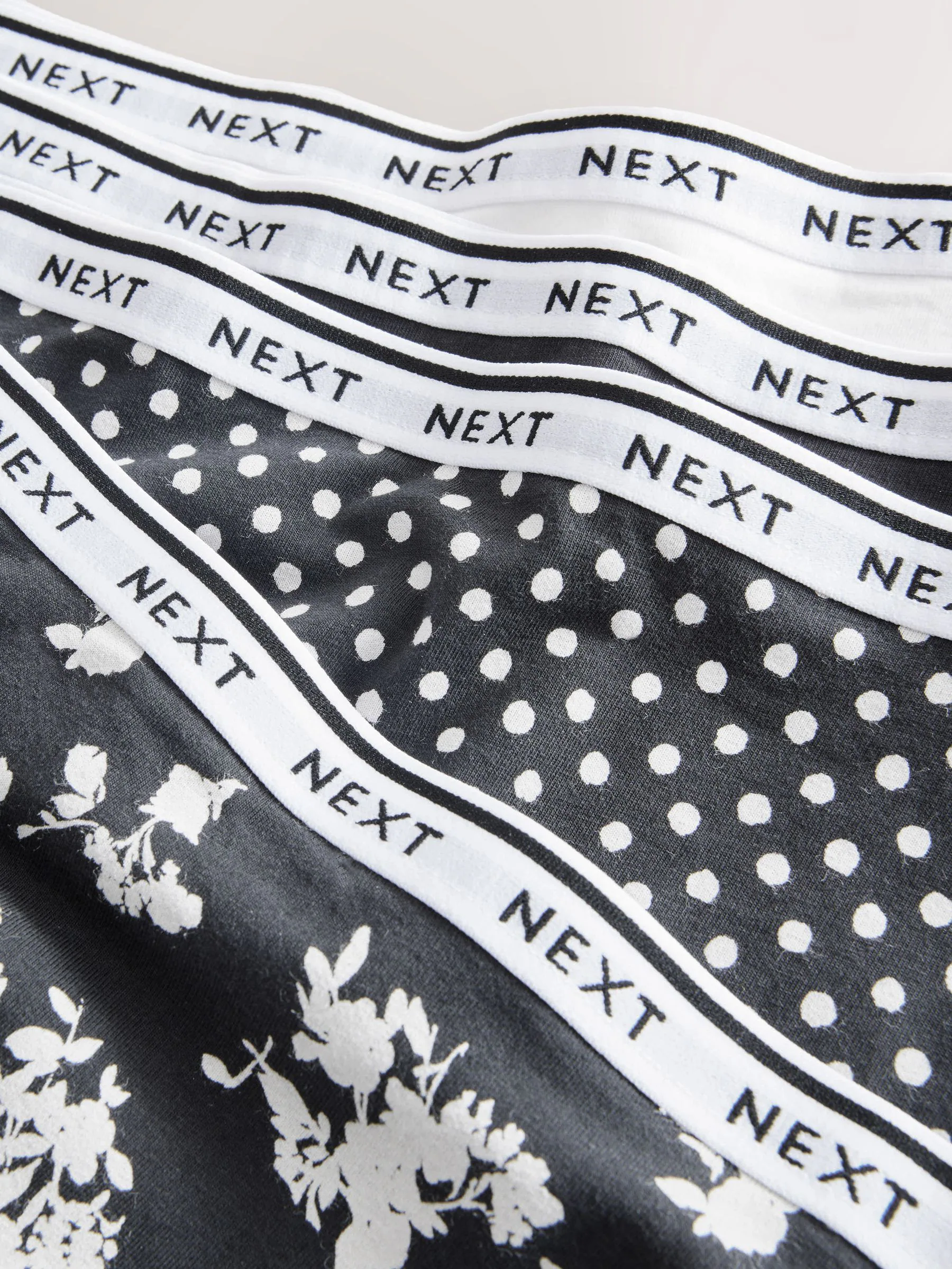 Zwart/wit met bloemenprint - 4 Katoenen slipjes met logotailleband