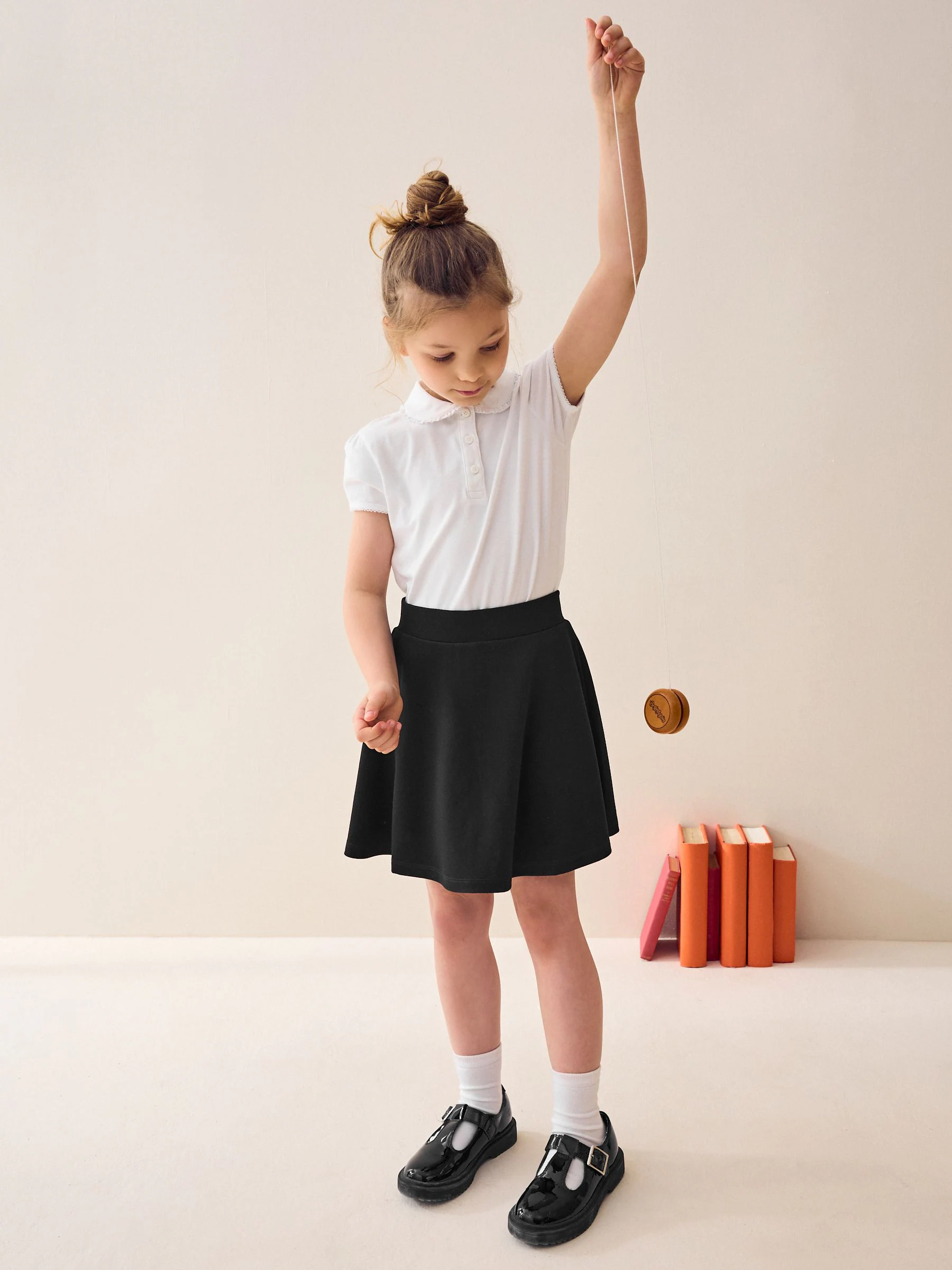 Zwart - Aantrekskirt voor school met jersey stretch (3-17jr)