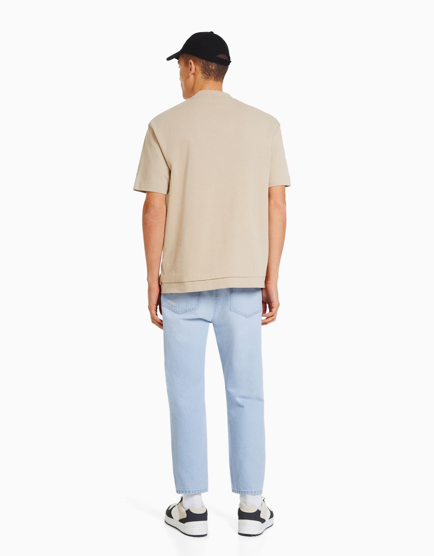Calça jeans folgada com rasgos