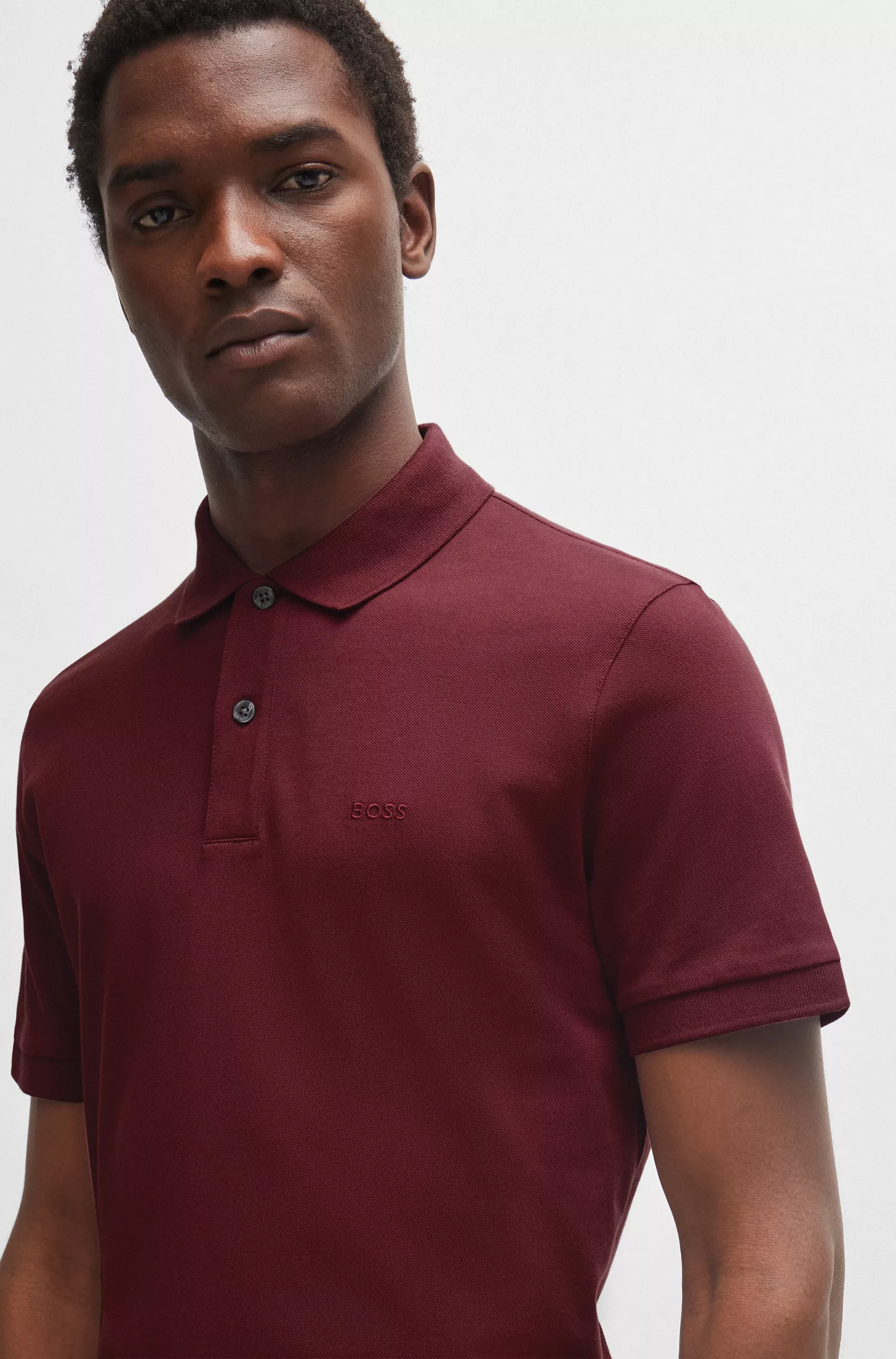 Camisa polo BOSS preta em algodão com logotipo bordado.
