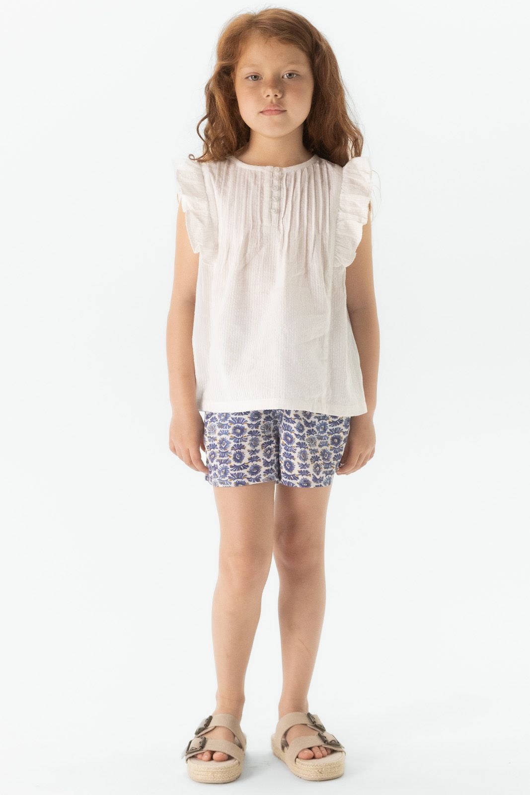 Witte mouwloze blouse met ruffle details