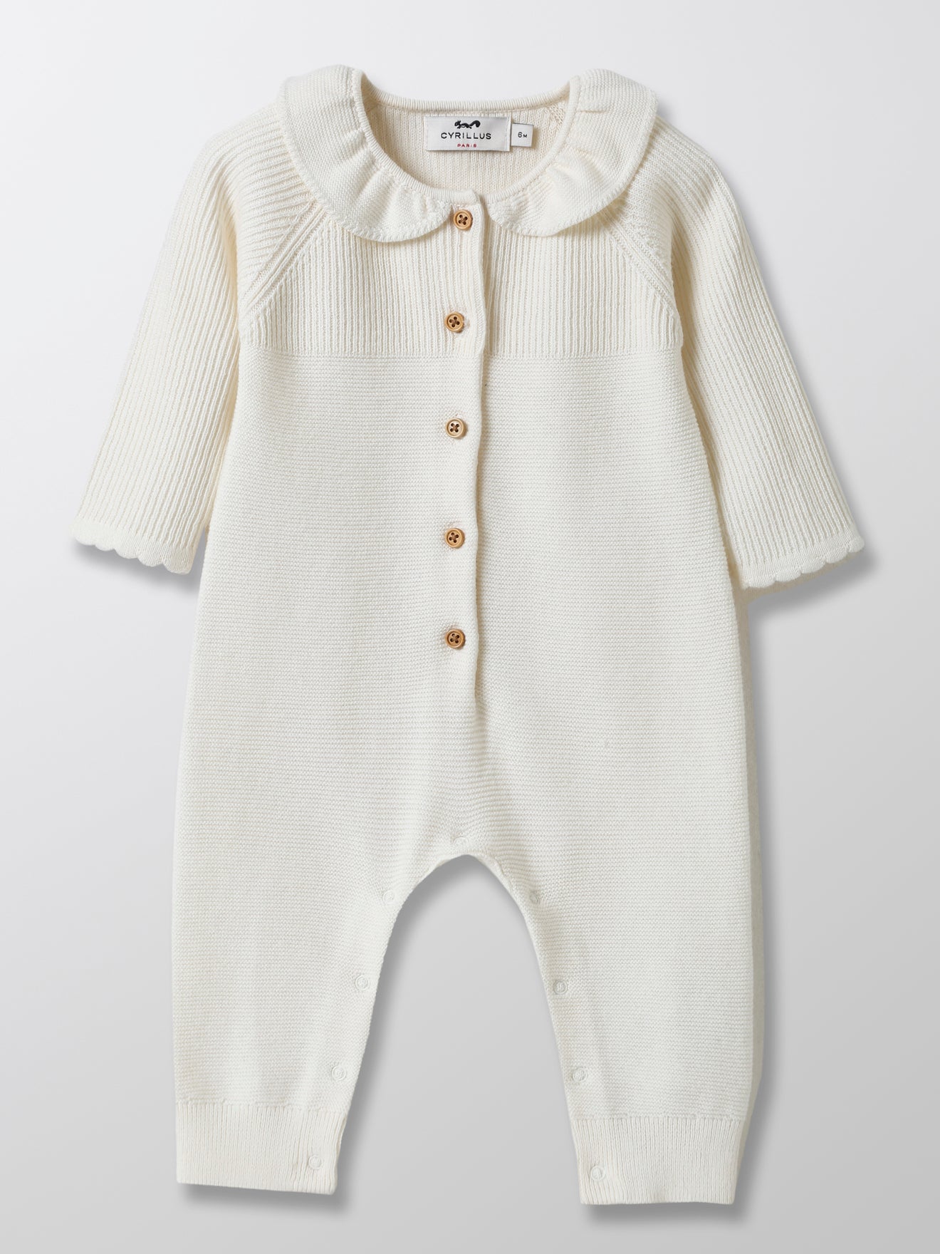 Combinaison bébé en tricot