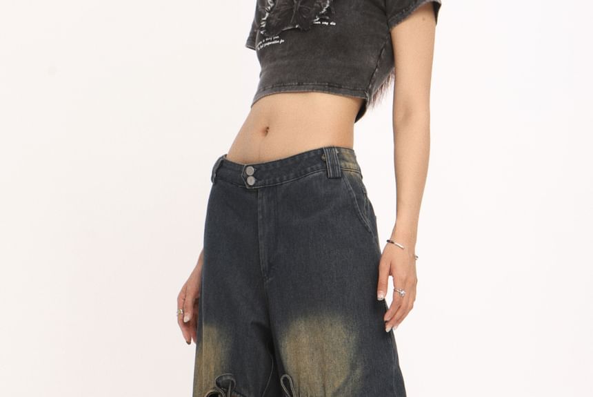 Berrytrix - Lage taille jeans met strikaccent en uitsparingen, gewassen en wijde pijpen