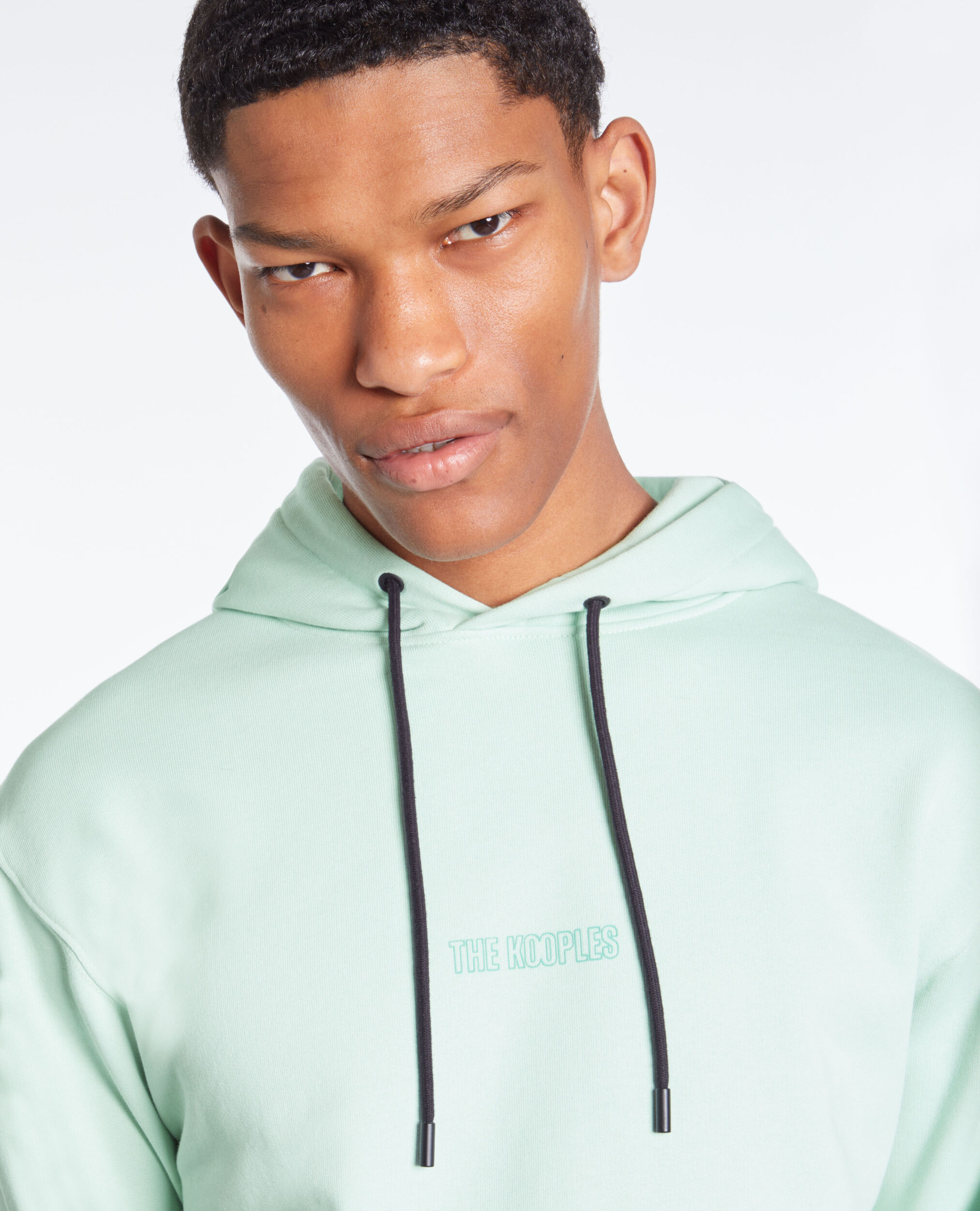 Sweatshirt à capuche vert avec logo