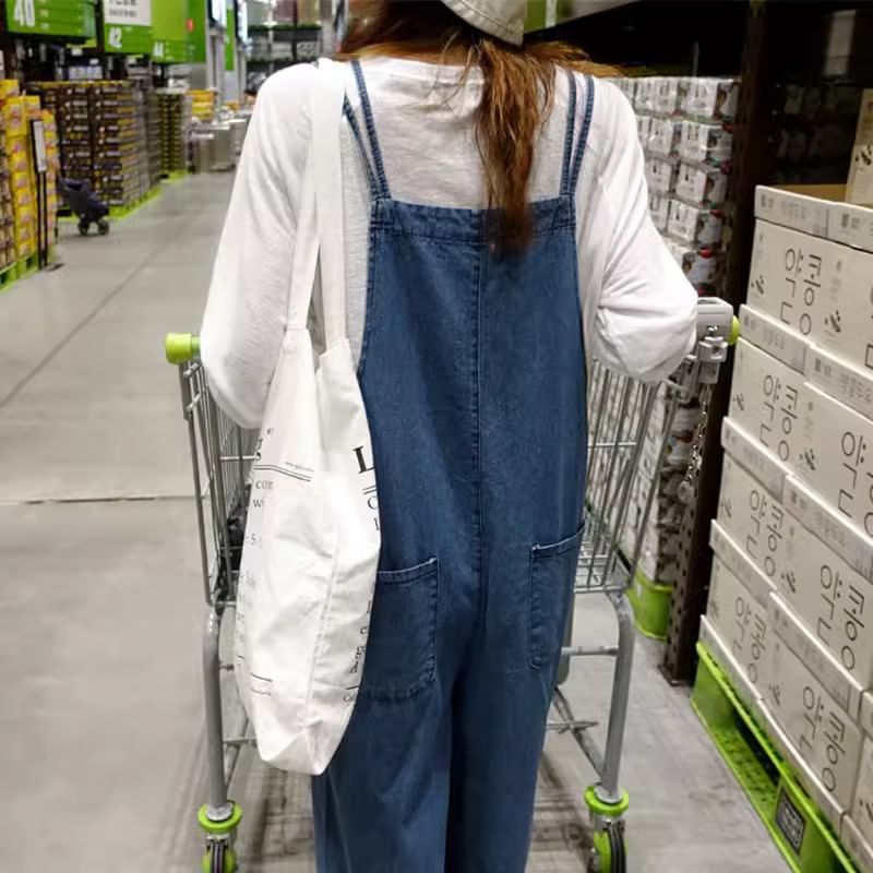 Felixia - Mouwloze denim jumpsuit met wijde pijpen