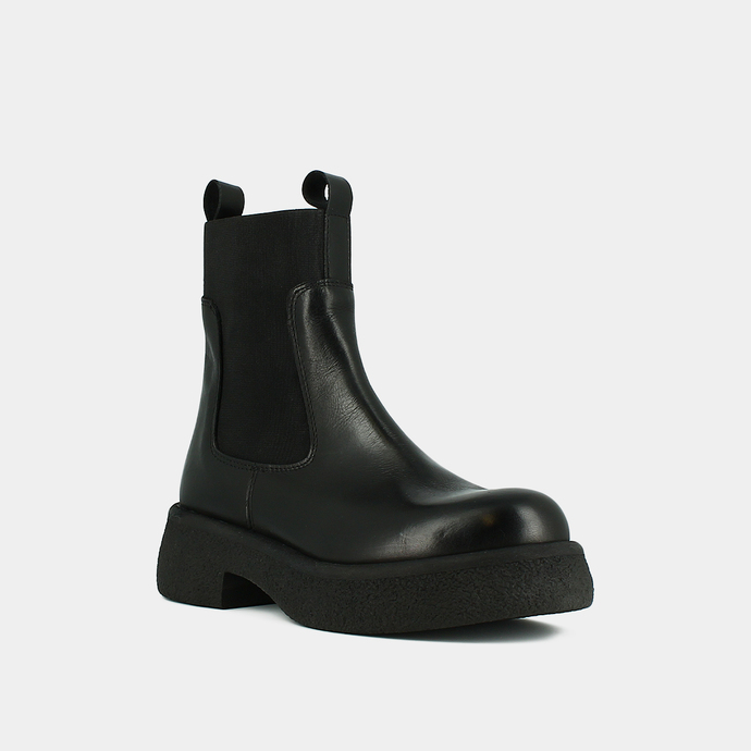 Boots à plateformes, élastiques et bouts...  en cuir noir