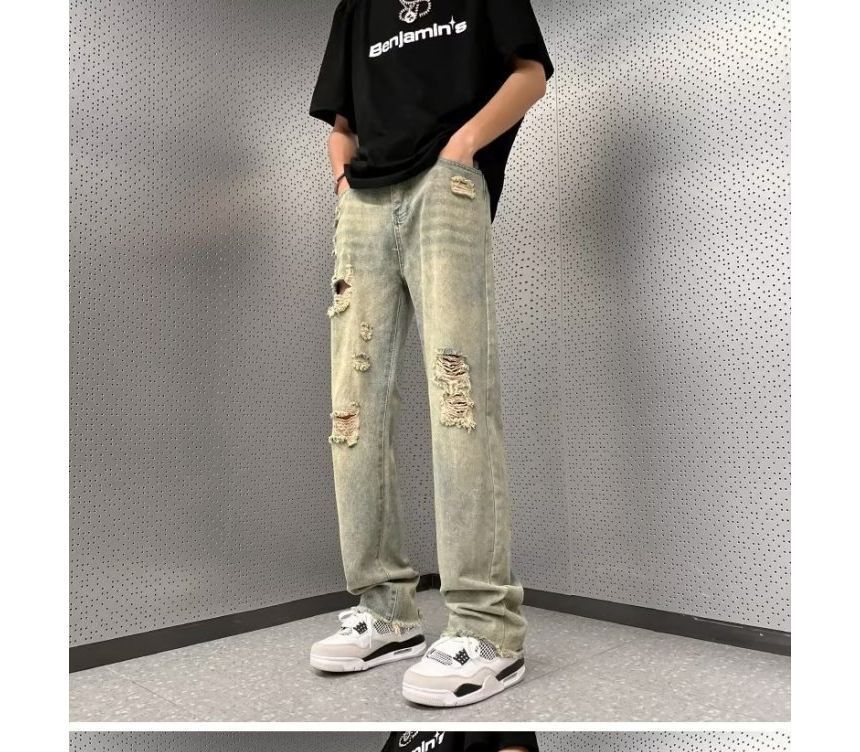 Femilina - High-waist distressed washed jeans met wijde pijpen