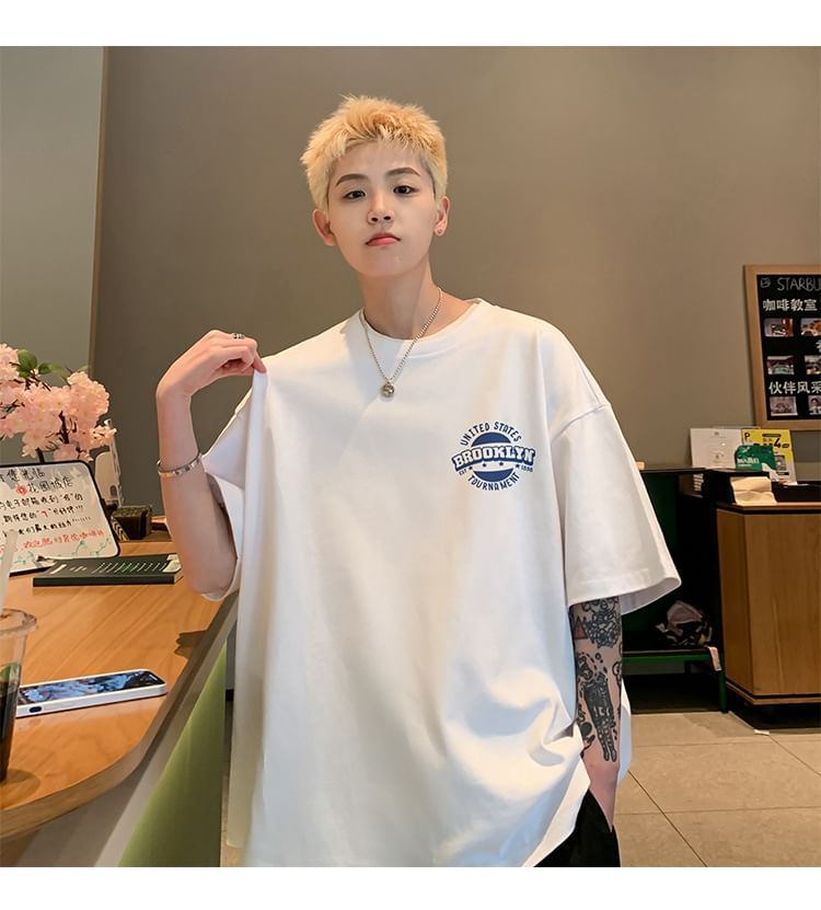 FOEV - T-shirt met korte mouwen, ronde hals en belettering
