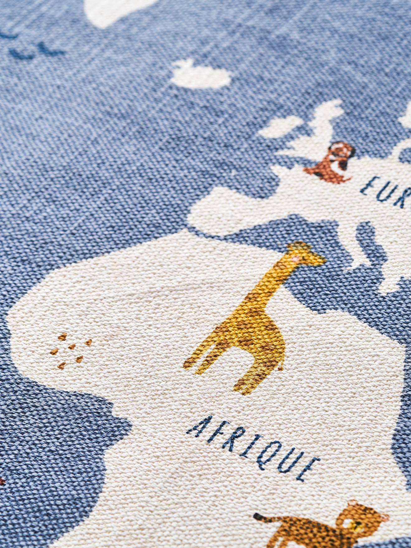Tapete redondo, mapa-múndi liso azul médio com motivos.