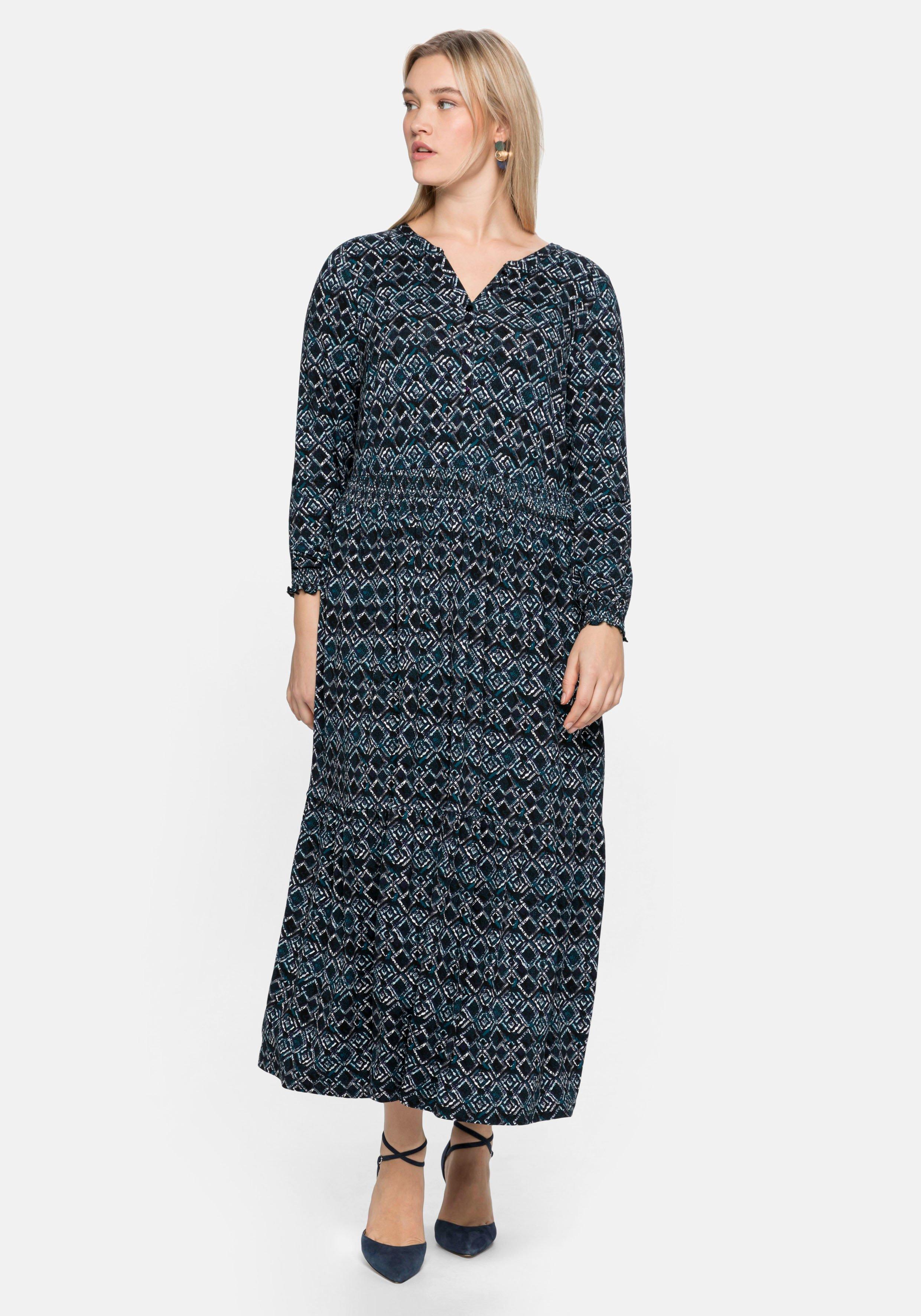 Jerseykleid mit Alloverdruck und Smokdetails