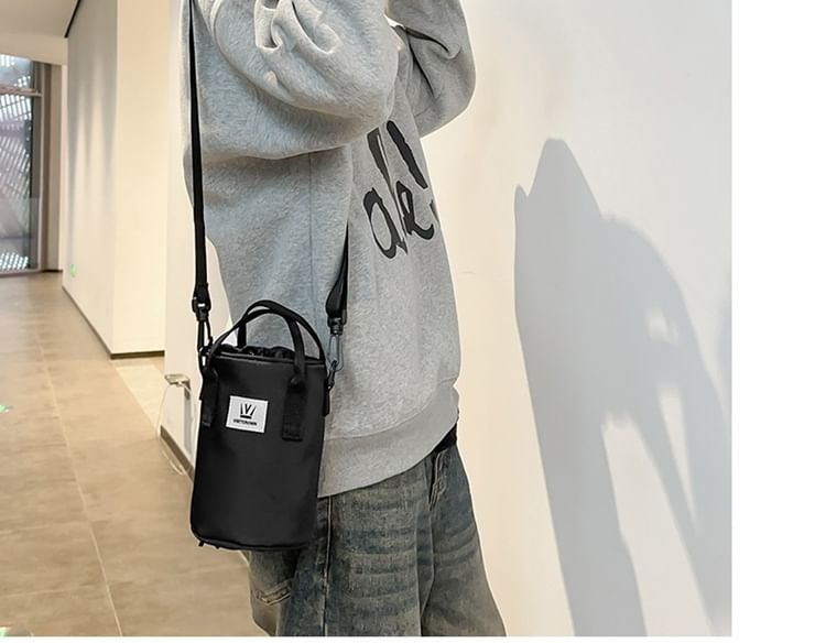 Hikuozy - Crossbodytas met trekkoord en letters