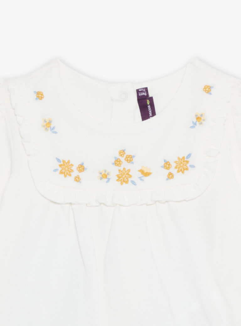 Chemisier écru avec legging et bandeau bleu marine à fleurs