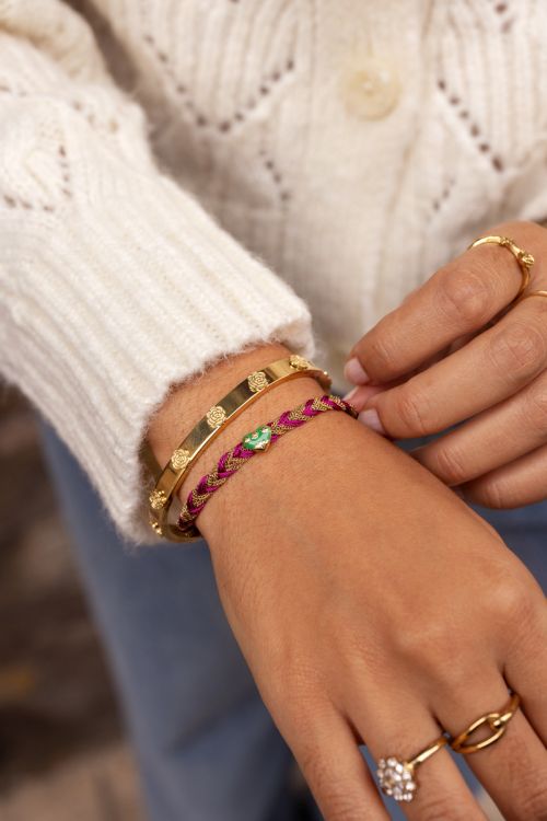 Roze gevlochten armband met bedel