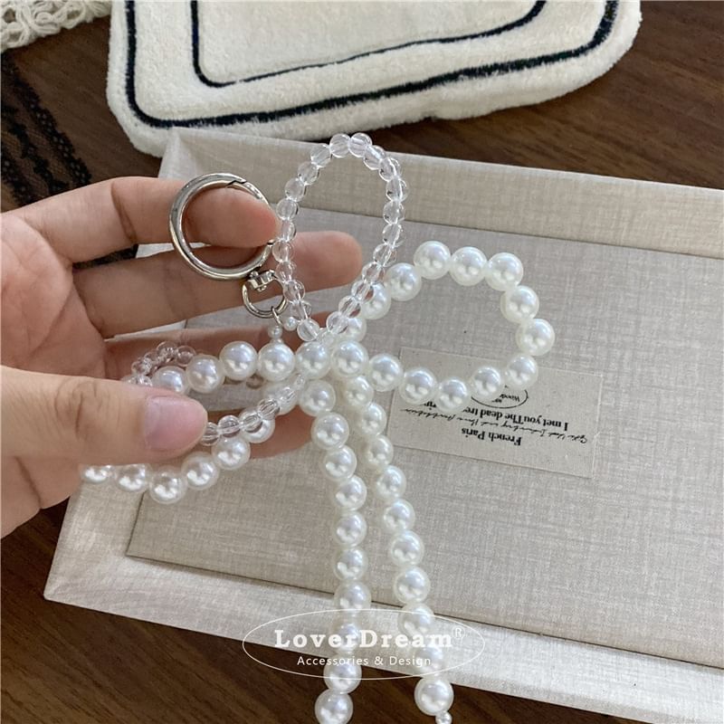 BeDaisy - Sleutelhanger met strik en imitatieparelkant