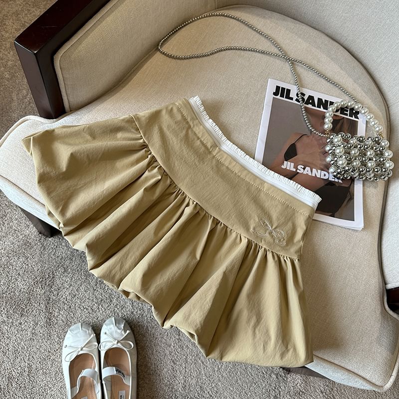 Bolgivy - Hoge taille rok met contrasterende rand en strikborduursel