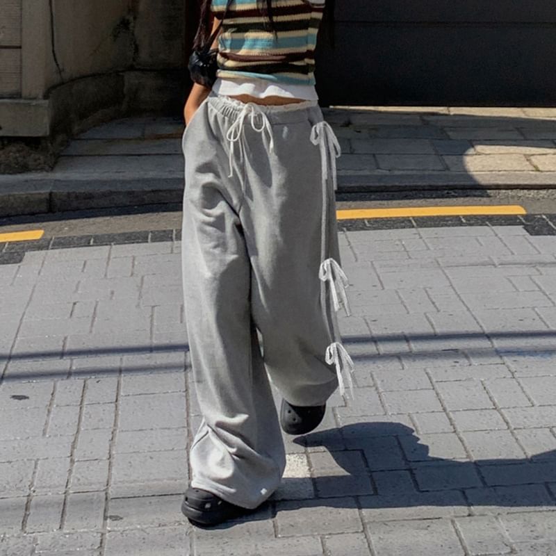 Honet - Losse, wijde joggingbroek met lage taille en strikaccent