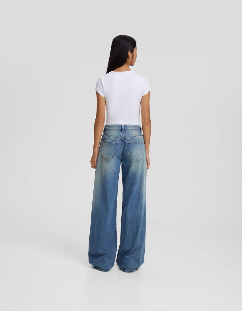 calça jeans de perna larga