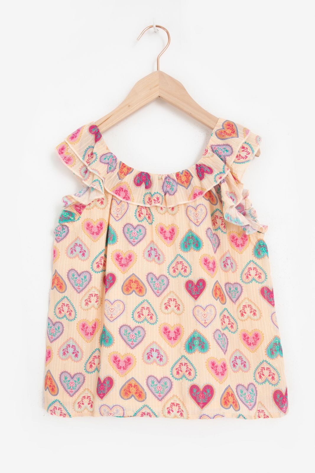 Lichtoranje top met ruffles en hartjes