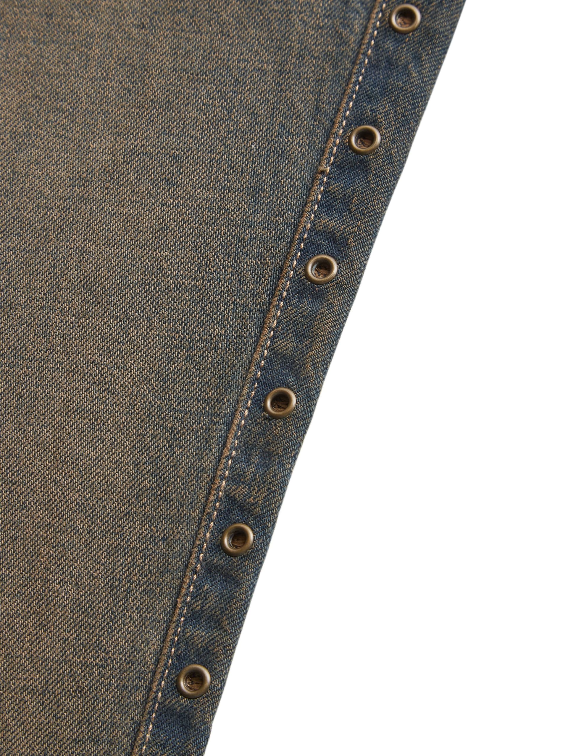 calça jeans de cintura baixa com ilhós