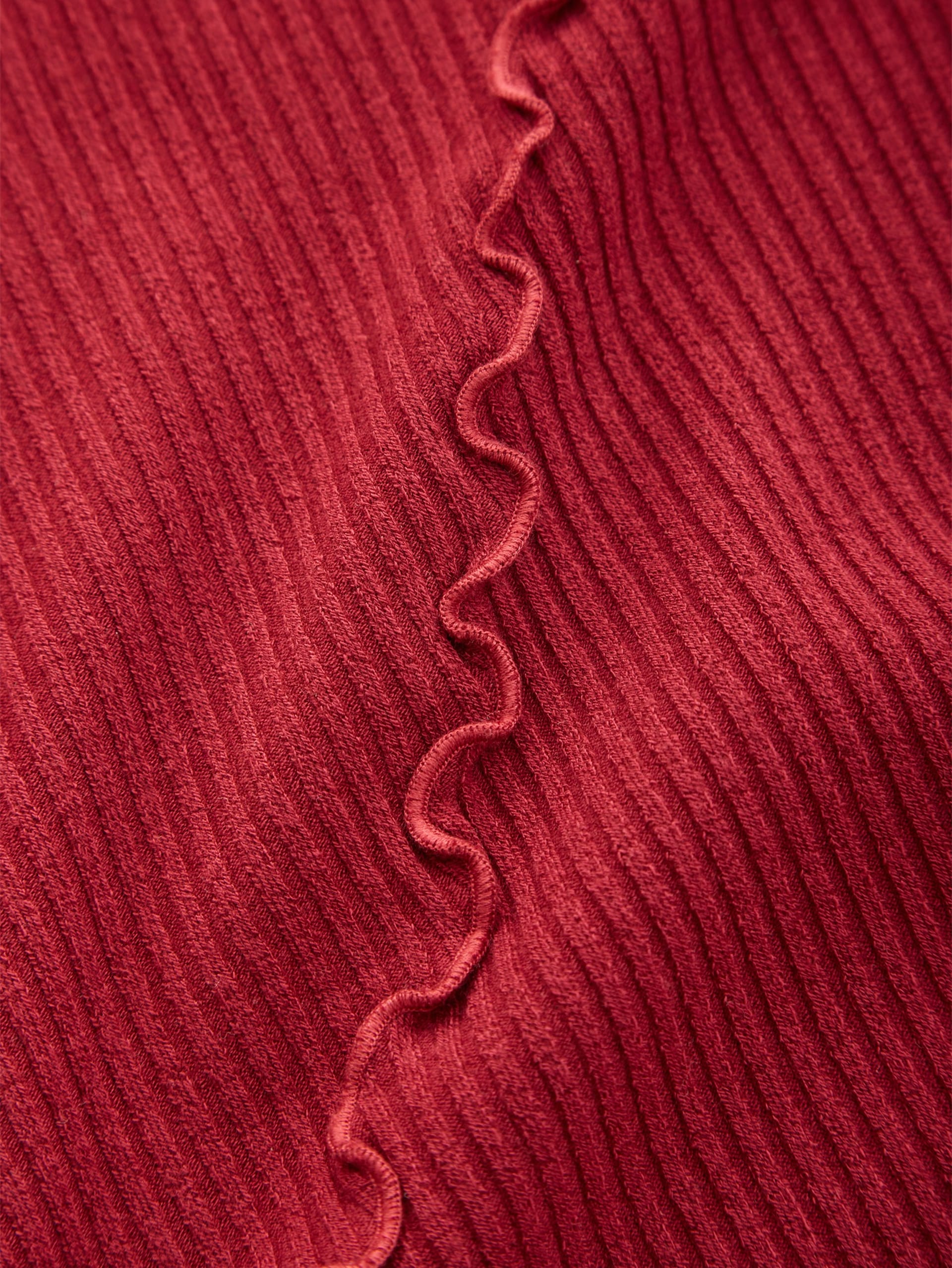 blusa de manga comprida com barra ondulada