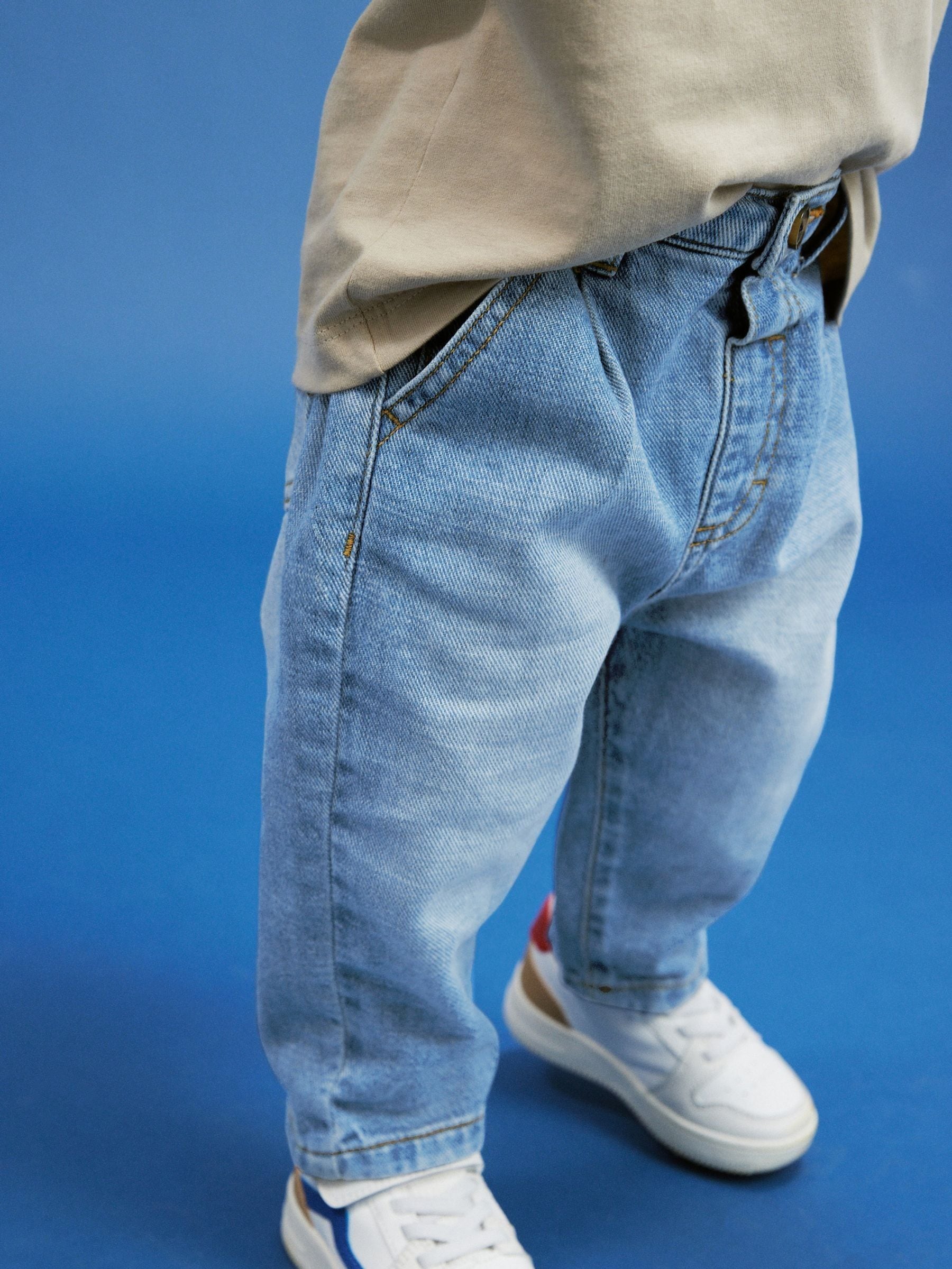 Lichtblauwe denim - Jeans met geplooide voorkant (3mnd-7jr)