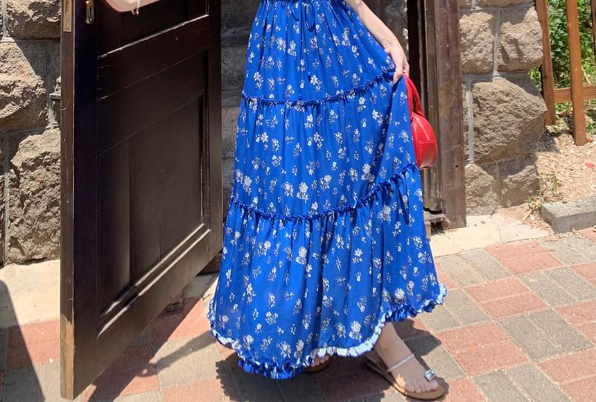Trendycas - Mouwloze ronde hals, bloemenprint, kanten paneel, volantrand, strik aan de voorkant en open rug, maxi-A-lijn jurk