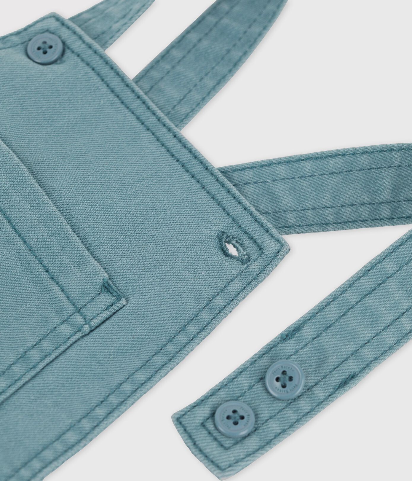 Salopette courte en denim coloré bébé
