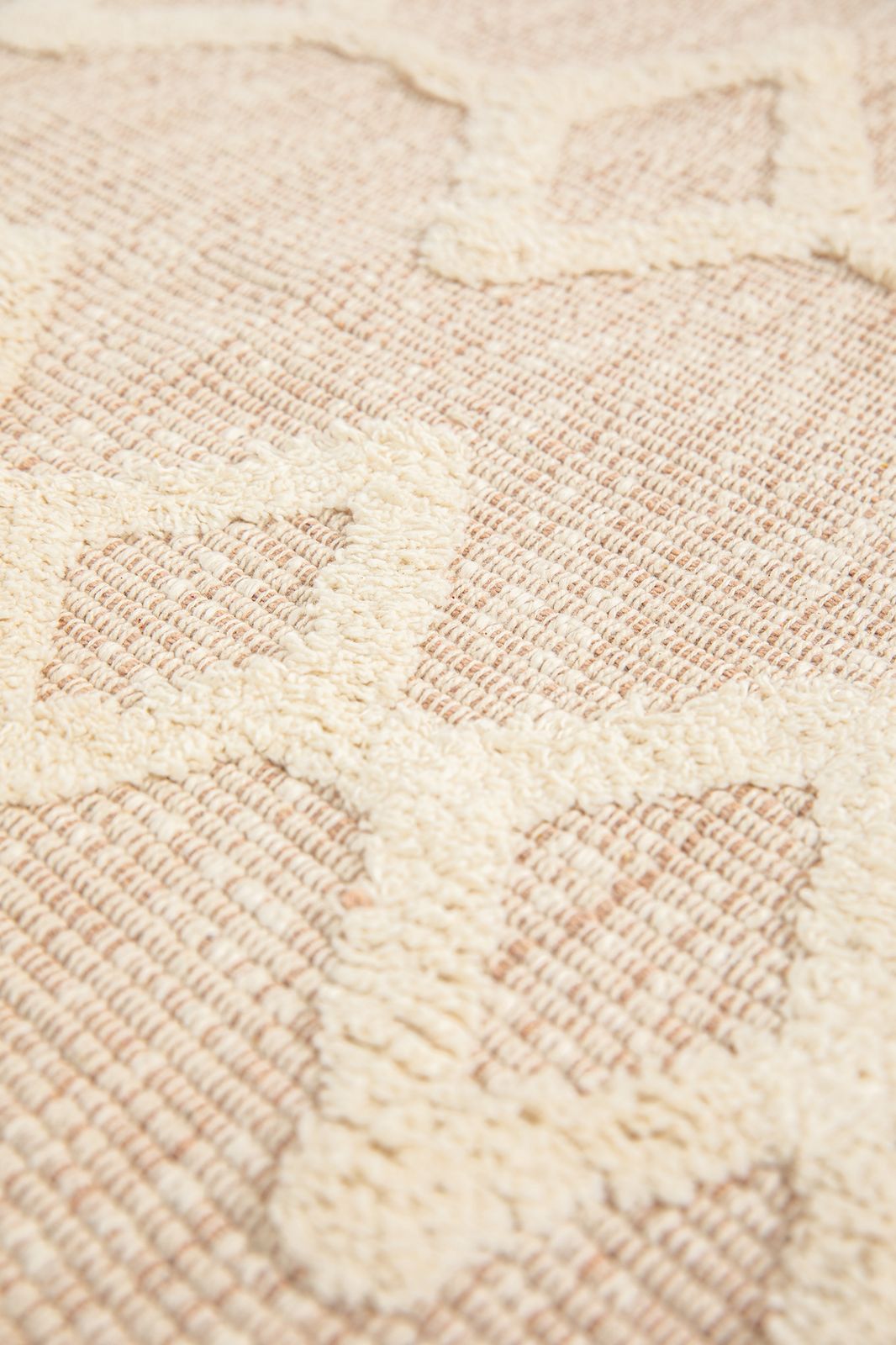 Beige badmat met geometrische figuren