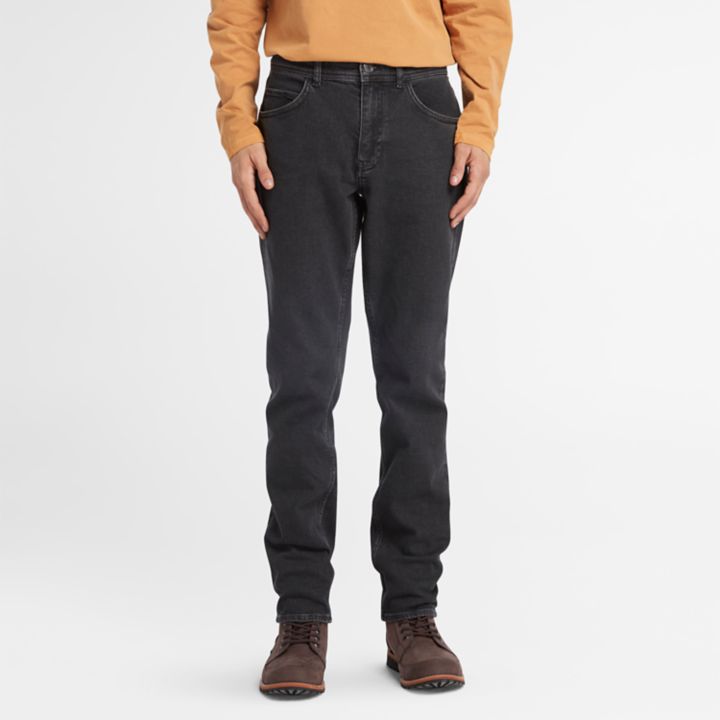 Calça jeans masculina preta com elastano e lavagem especial em cinza escuro.