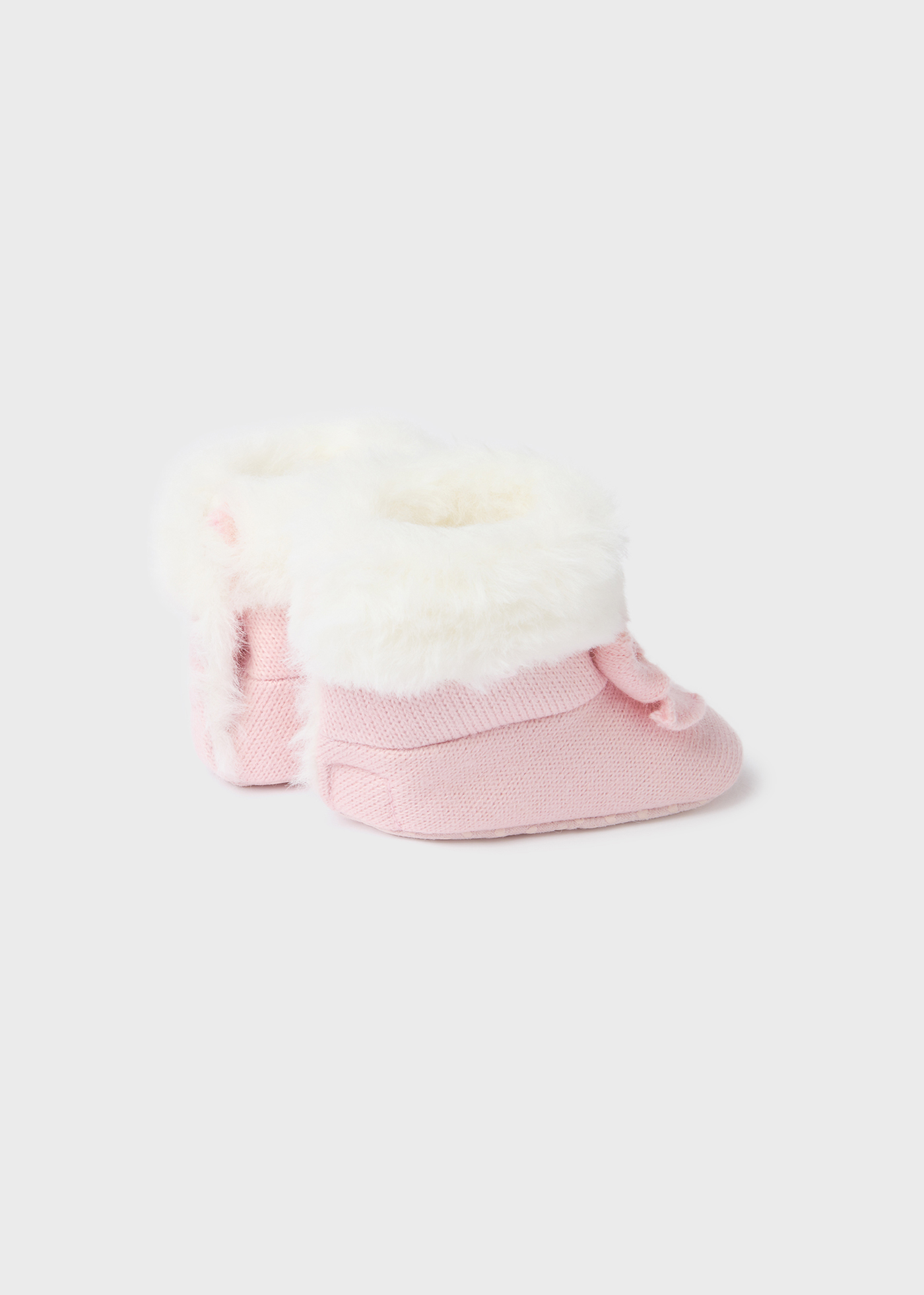 Bota de tricô com pelo de recém-nascido