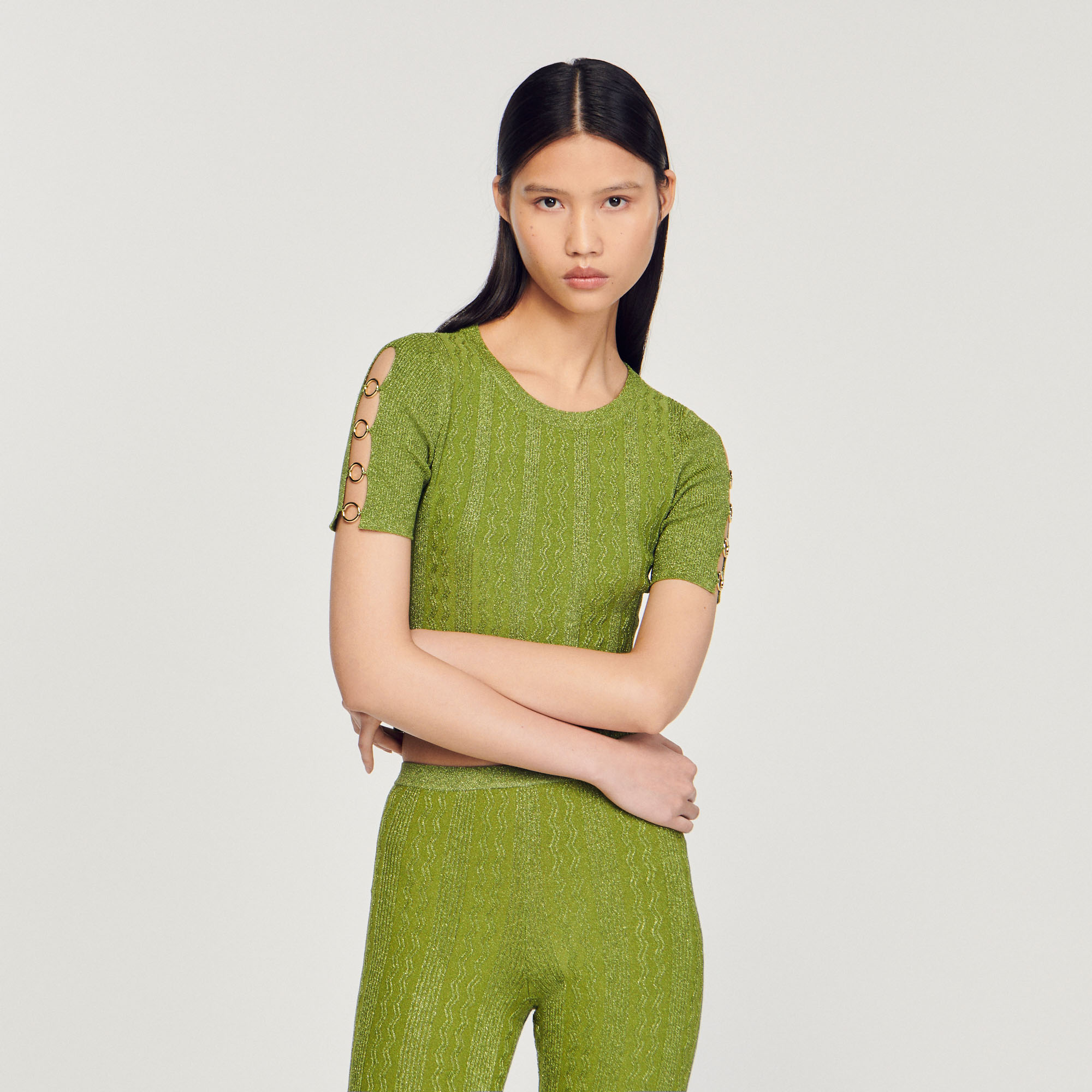 Pull court en maille metallisee