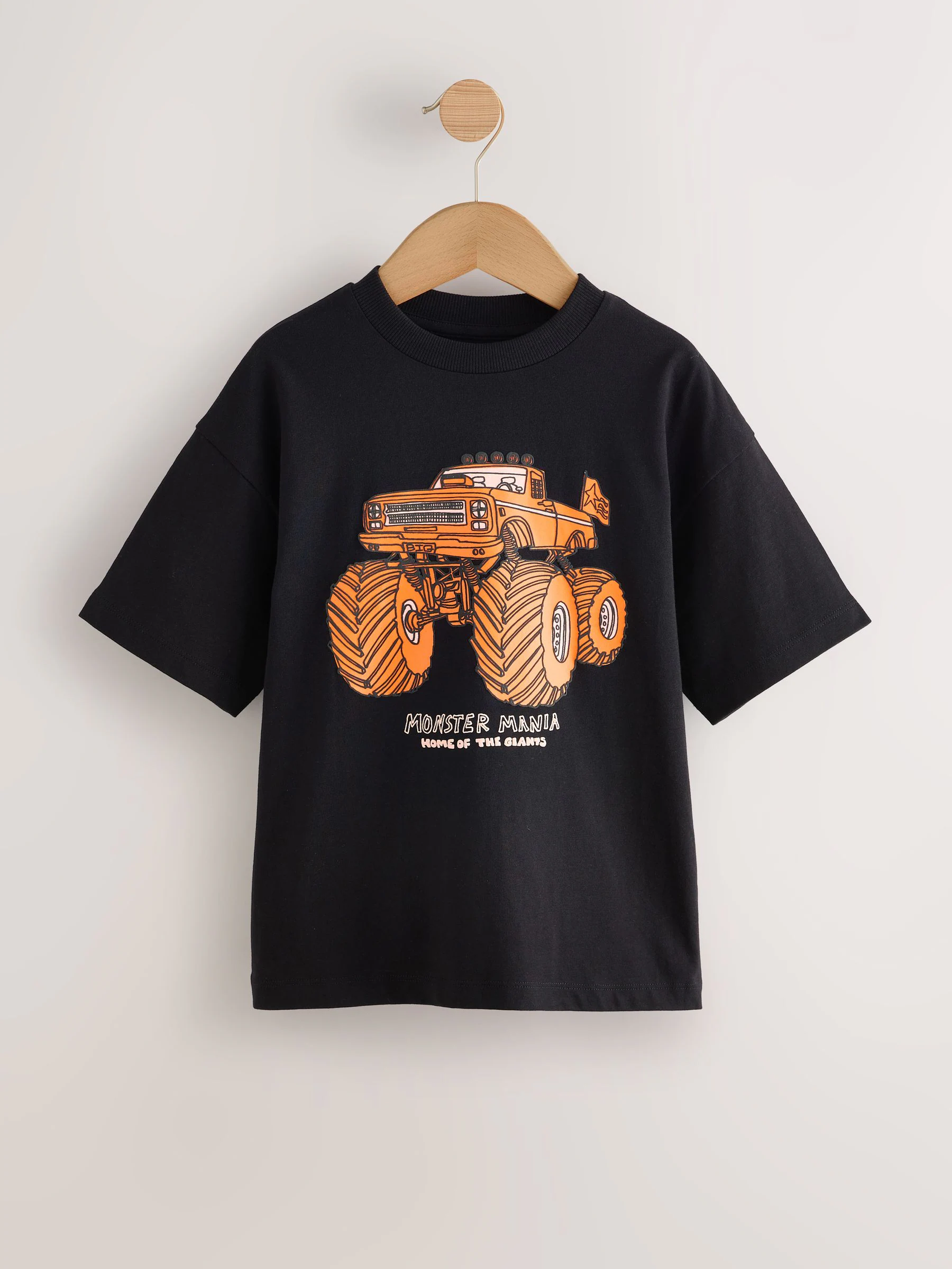 Zwart met oranje monstertruck-print - Ruimvallend T-shirt met print en korte mouwen (3-16 jr)