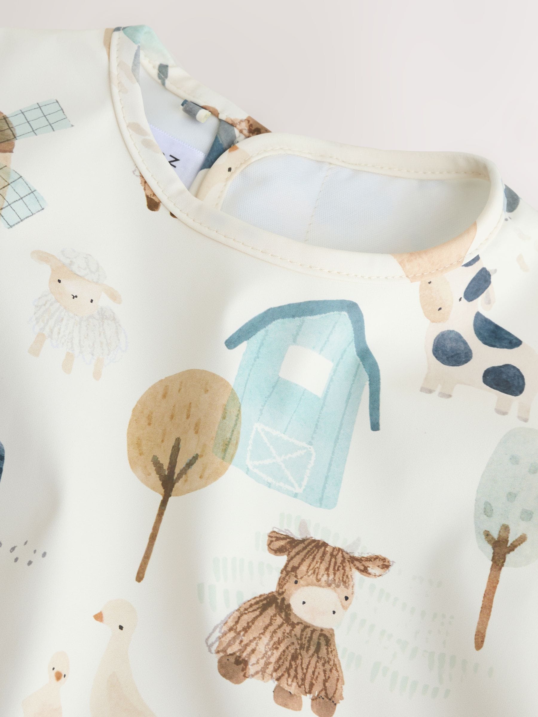 Neutraal - Slabbetje met mouwen voor spenen en voeden