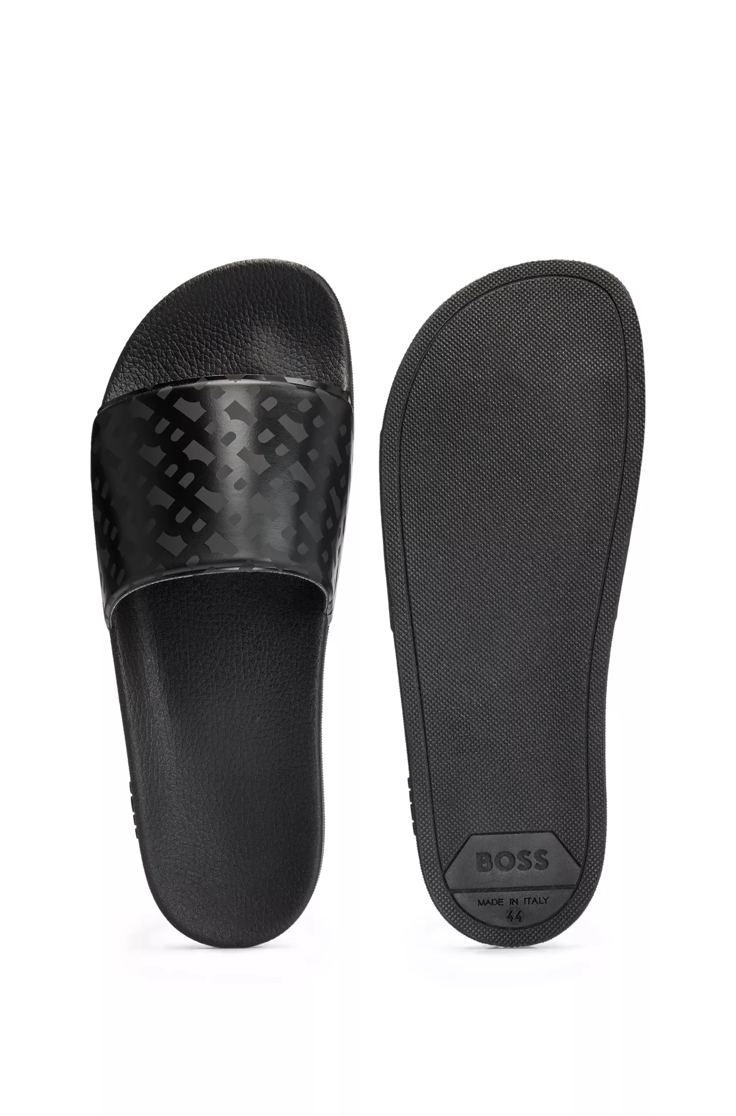 Sandálias BOSS pretas, fabricadas na Itália, com tira monogramada.