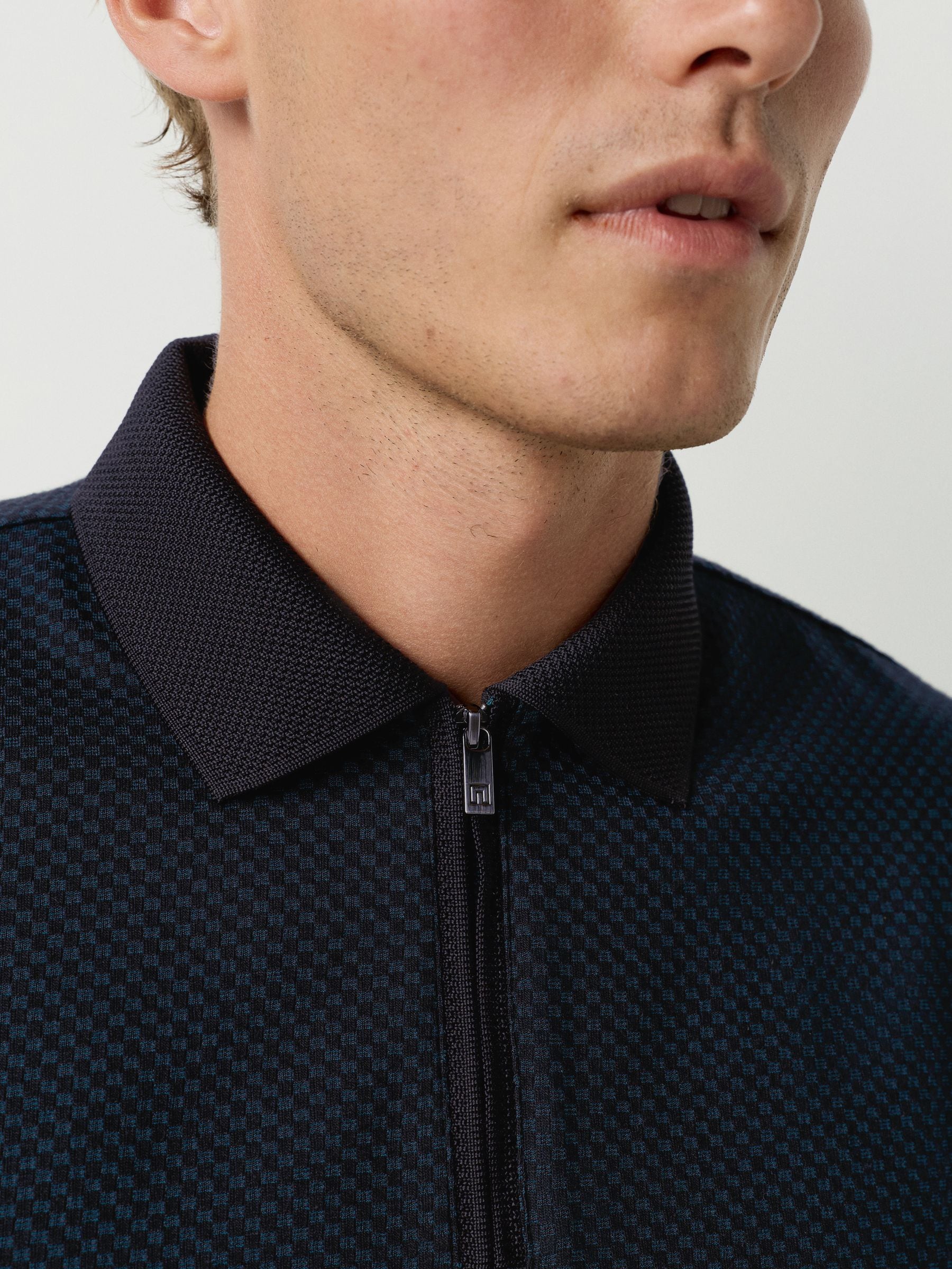 Blauwgroen - Modieus poloshirt met kwartrits