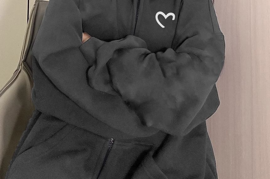 Carotaine - Oversized hoodie met hartprint en rits