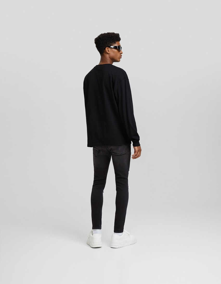 calça jeans super skinny rasgada