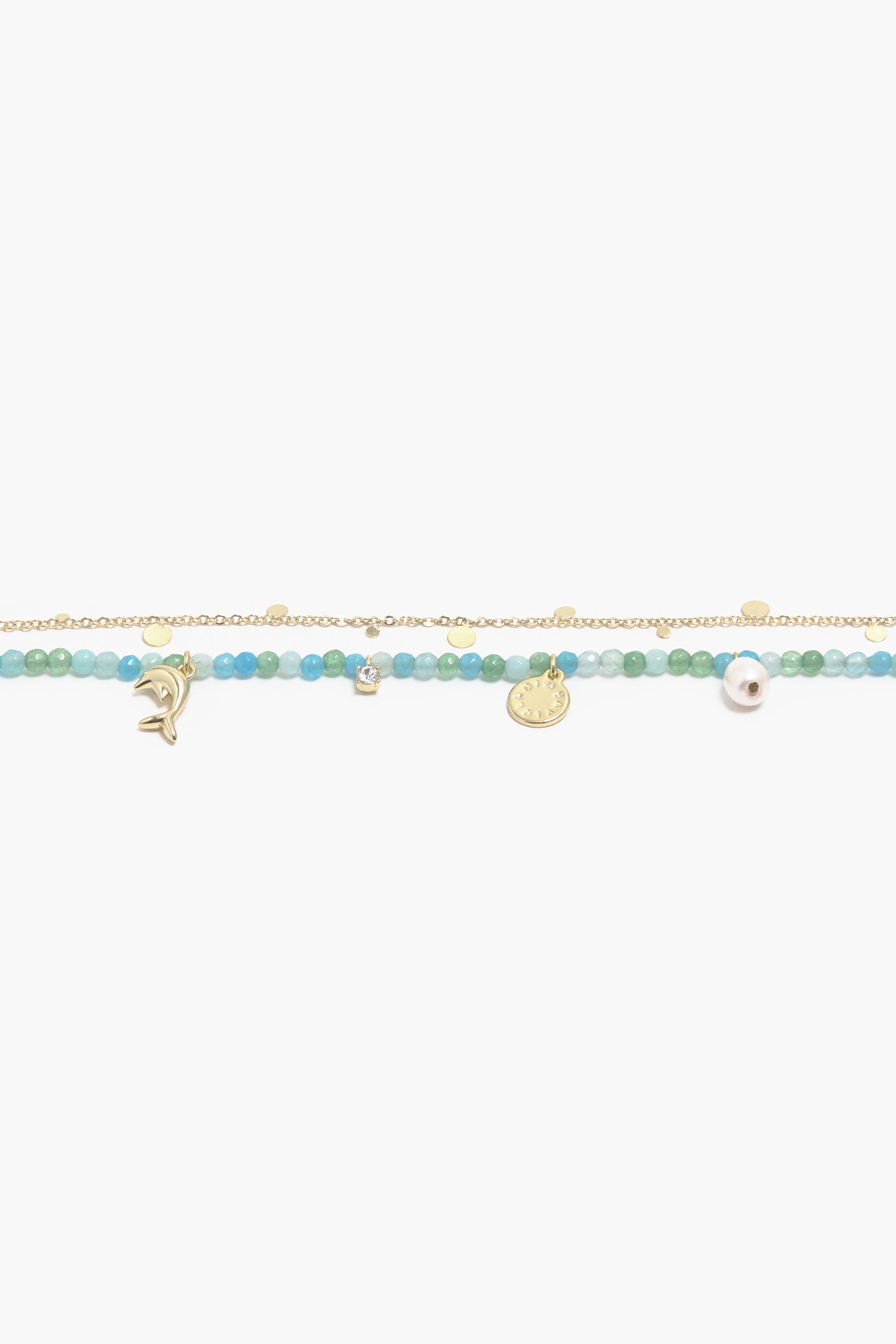Colar curto com pingente de golfinho e pedras turquesa.