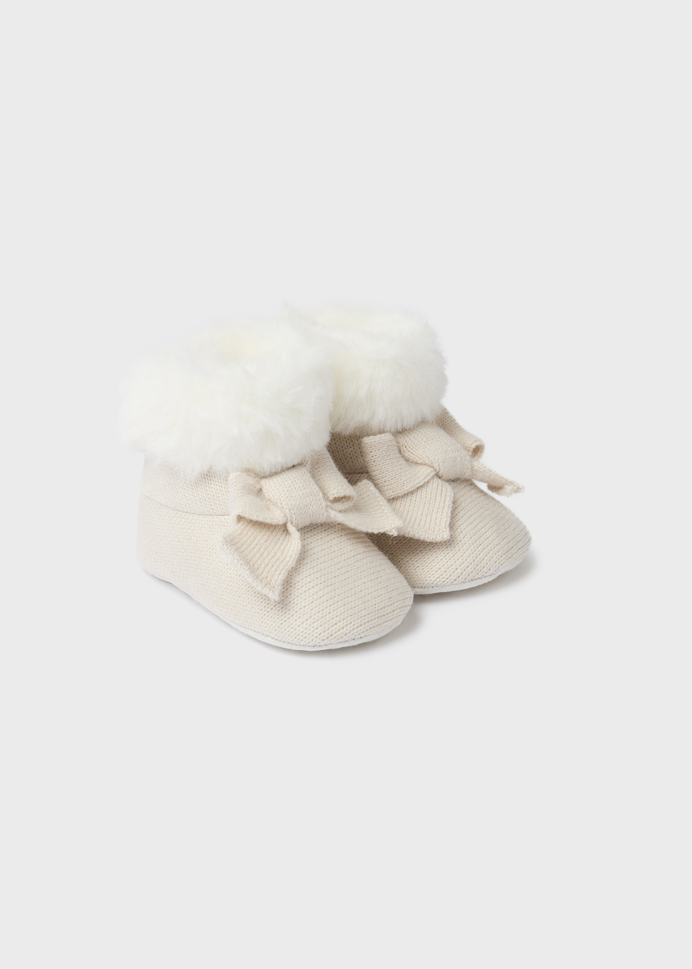 Bota de tricô com pelo de recém-nascido