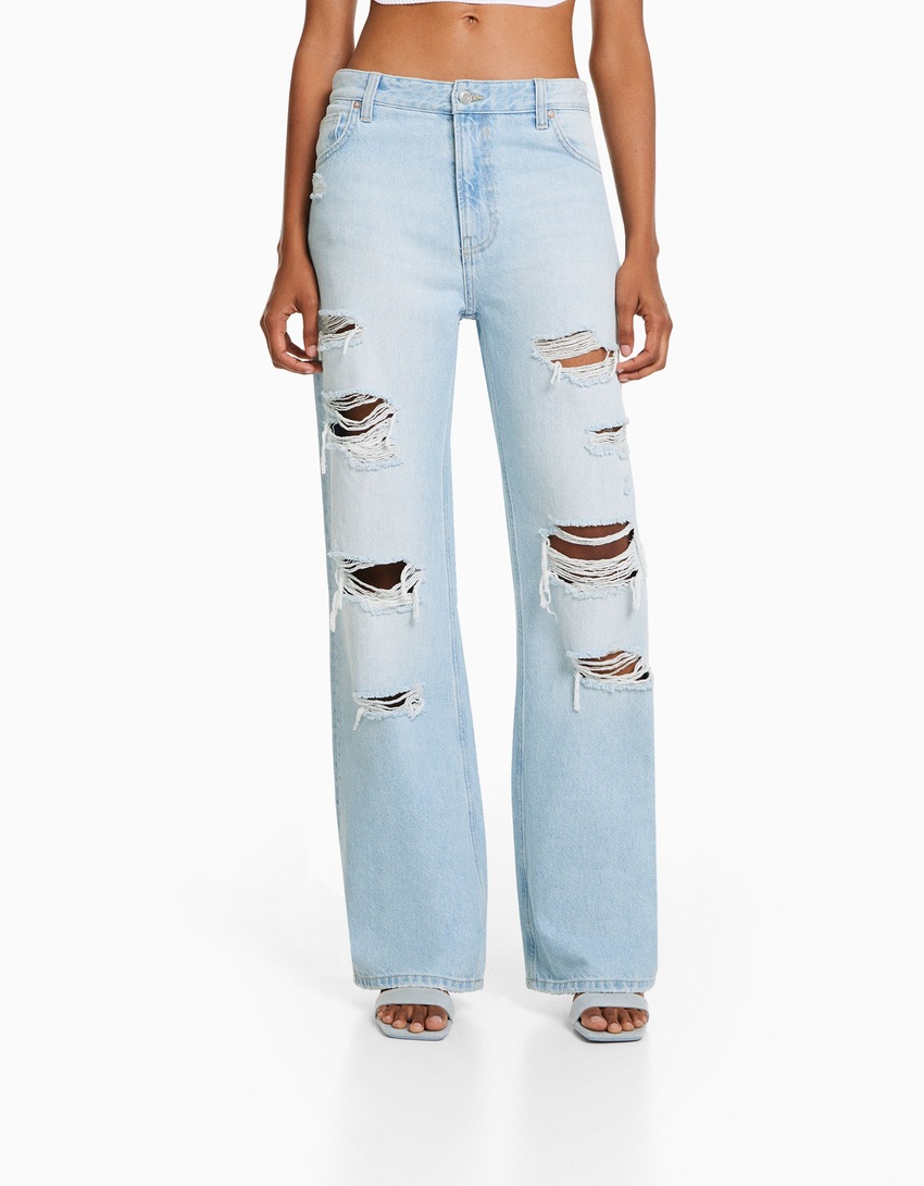 Calça jeans rasgada de perna larga dos anos 90