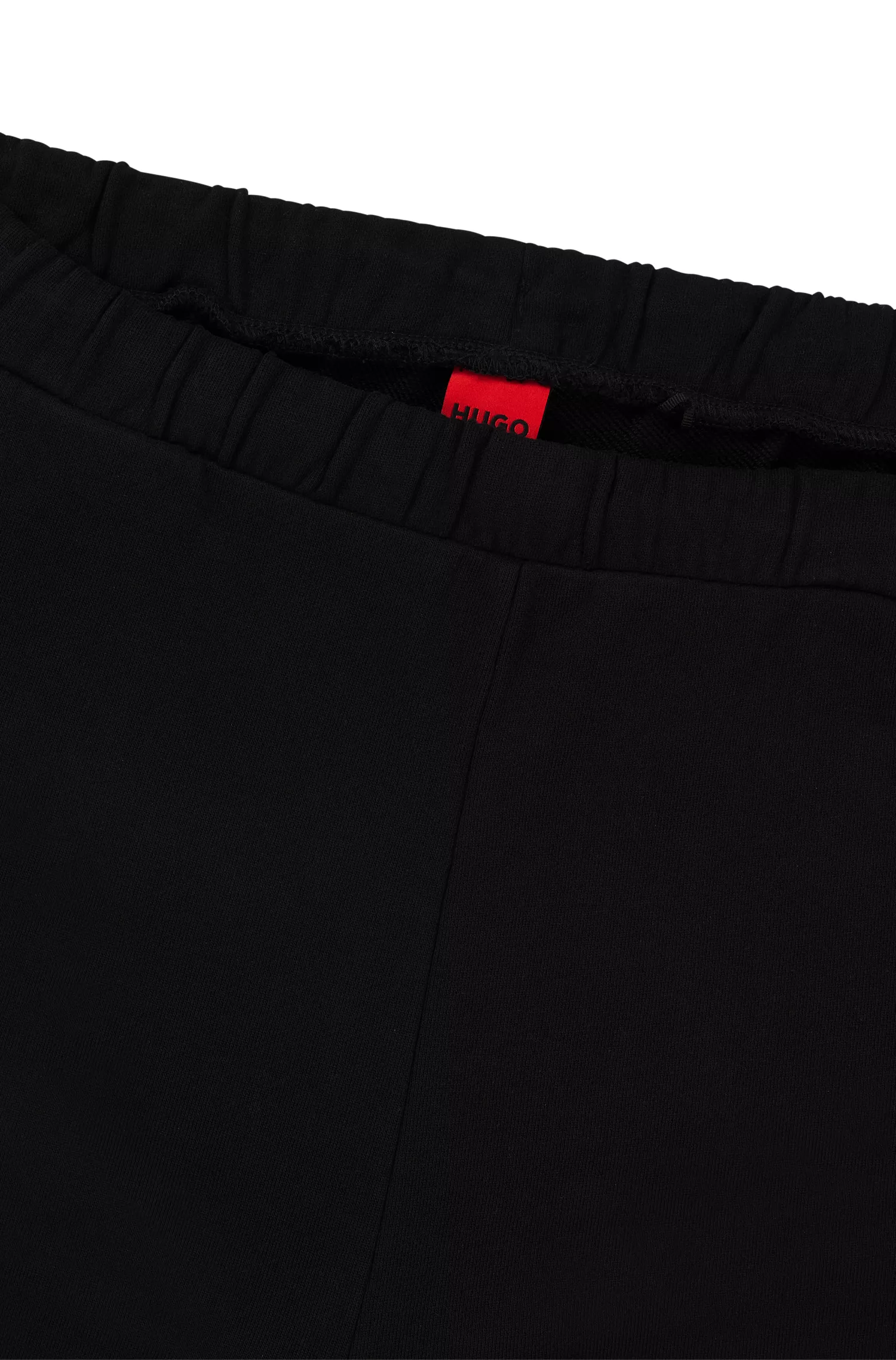 Calça de fato de treino HUGO em tecido atoalhado de algodão vermelho com logótipo vertical.