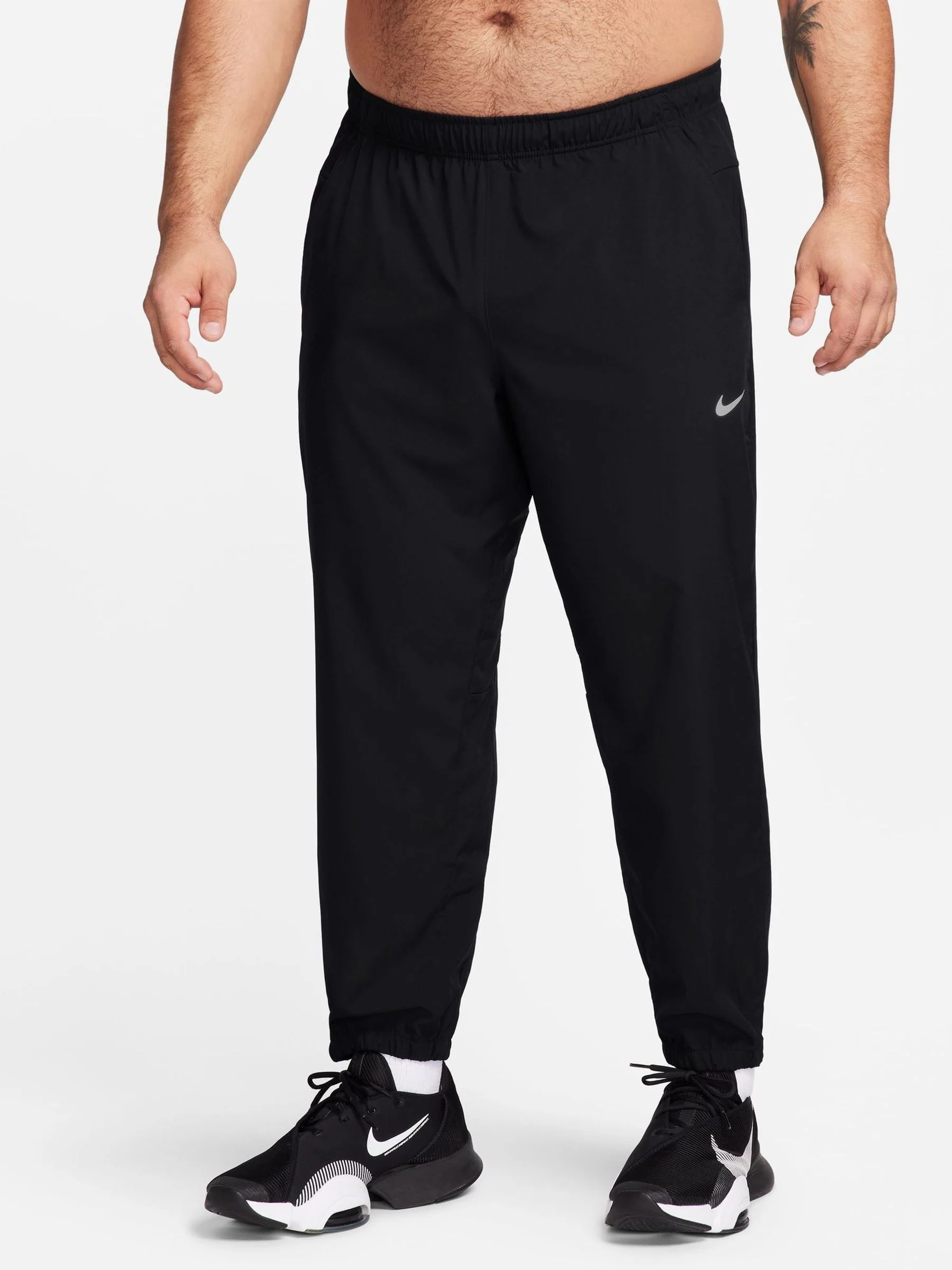 Zwart - Nike Dri-FIT Form trainingsbroek met taps toelopende pijpen